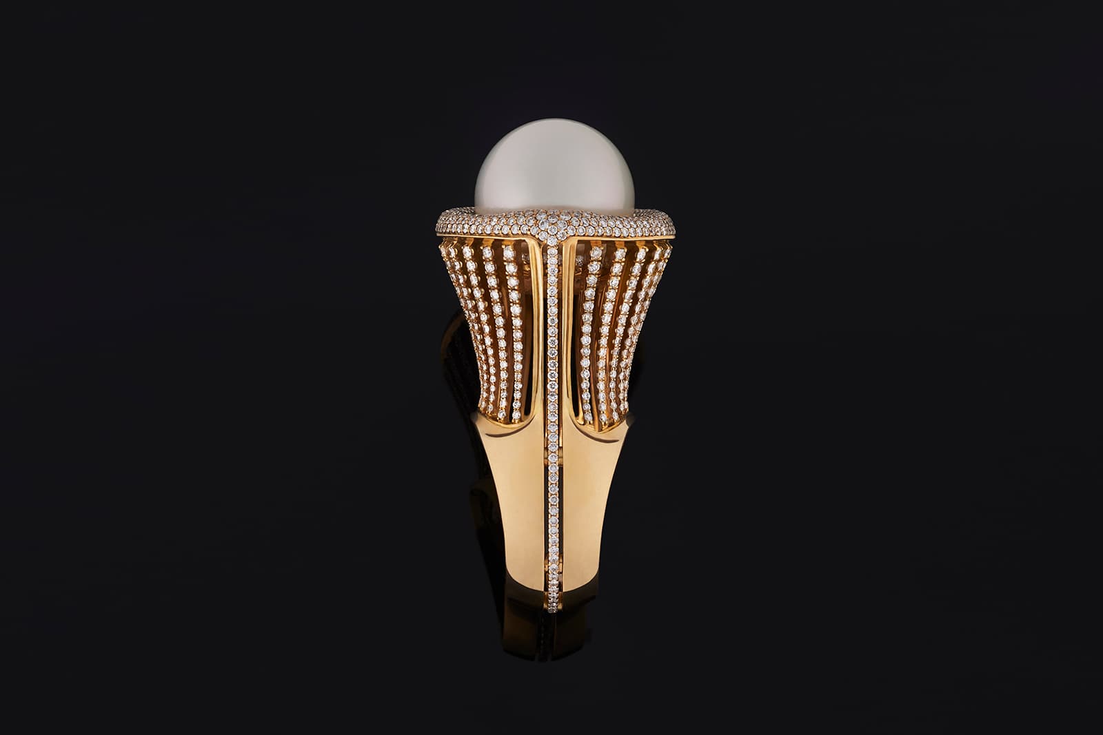  The pearl in this Gers Jewellery ring is lifted high off the finger with a framework of yellow gold and diamonds