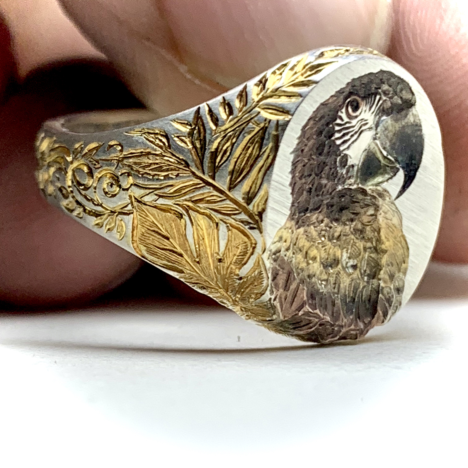 Przemyslaw Beres signet ring with a hand-engraved macaw design 