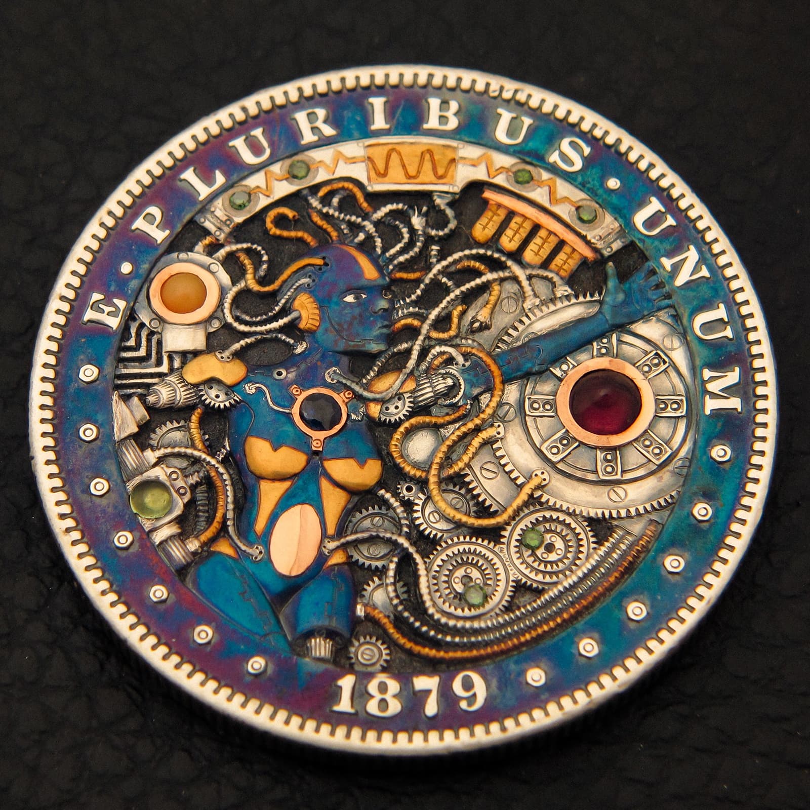  Joshua Ranger 'Birth of A.I.' hand-carved 1879 Morgan dollar with inlaid 24k gold, platinum, 18k rose gold, green diamond, peridot, blue sapphire, opal, and garnet