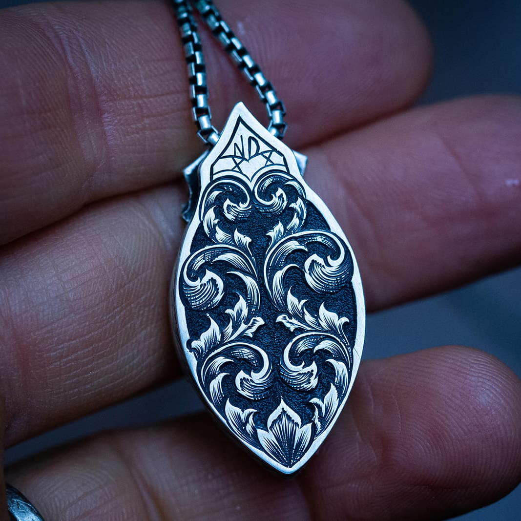  hand-engraved design on the reverse of a pendant by Nick Noyes of Noyes Designs 