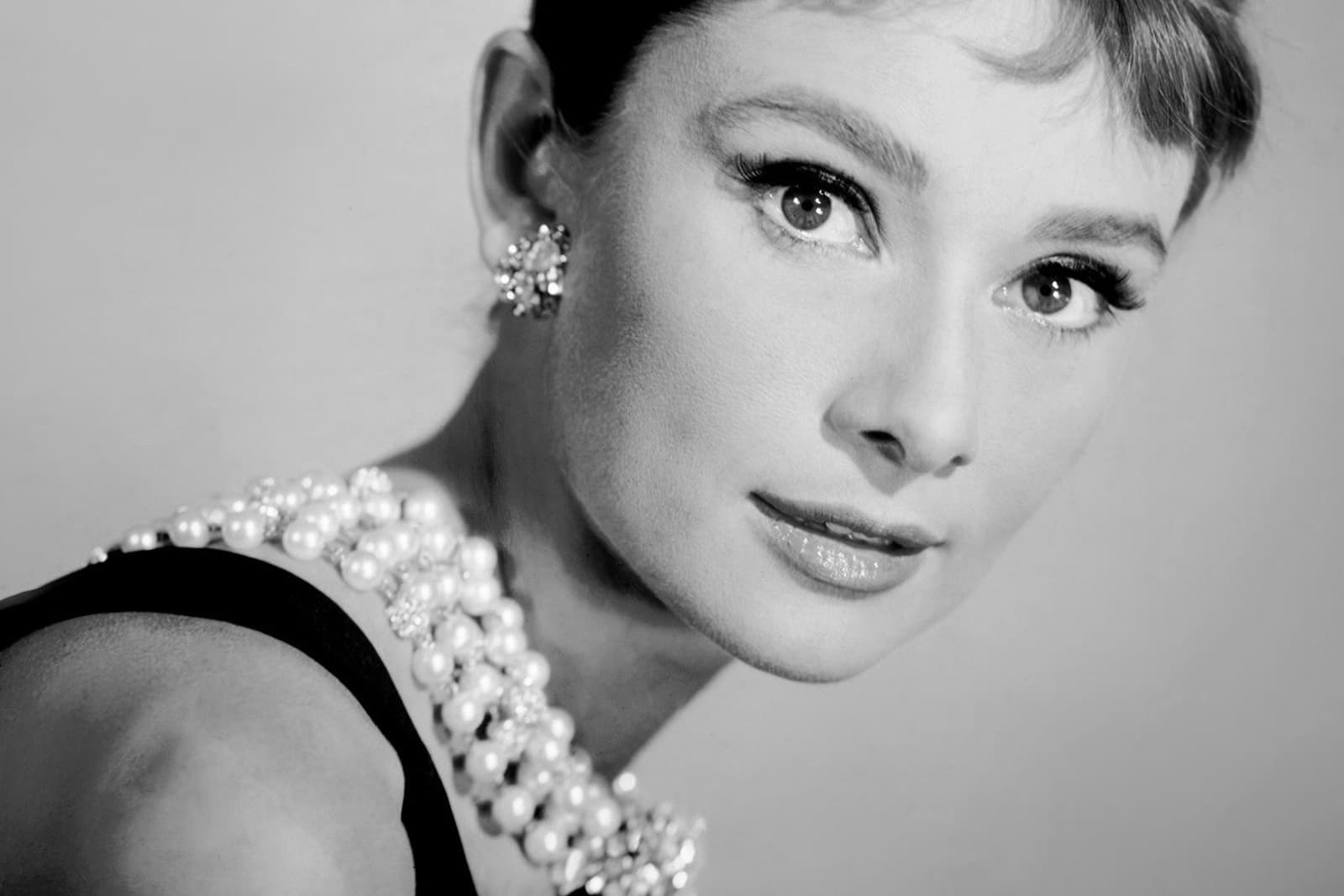  Audrey Hepburn as Holly Golightly in the 1961 film Breakfast at Tiffany's in the character's signature pearls