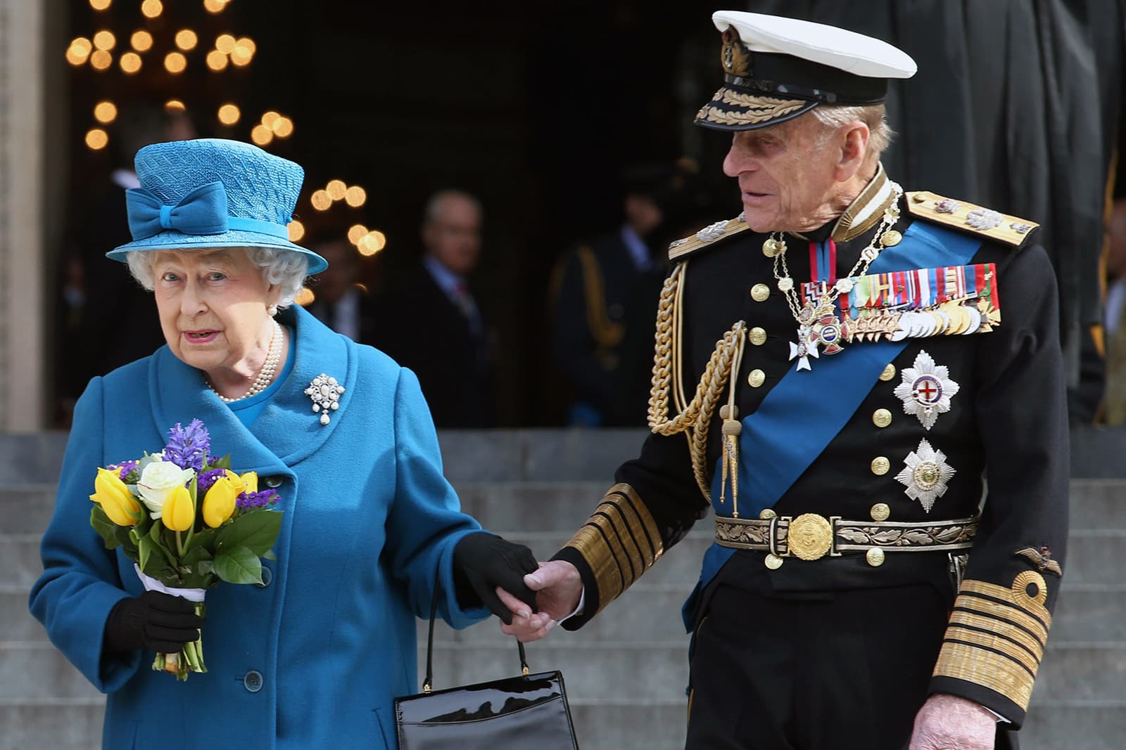 Queen Elizabeth II wearing a pearl necklace and elaborate pearl brooch at an official engagement