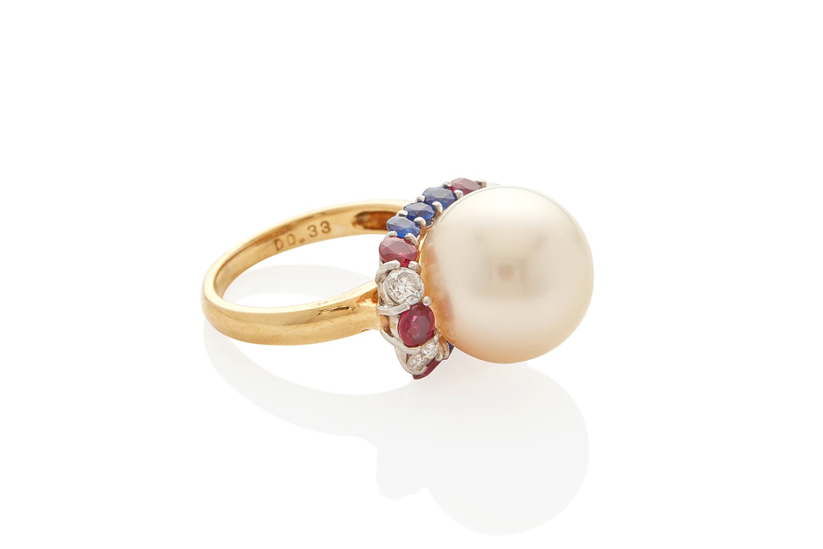  An 18k bi-colour cultured pearl and gem-set diamond halo ring auctioned by Bonhams