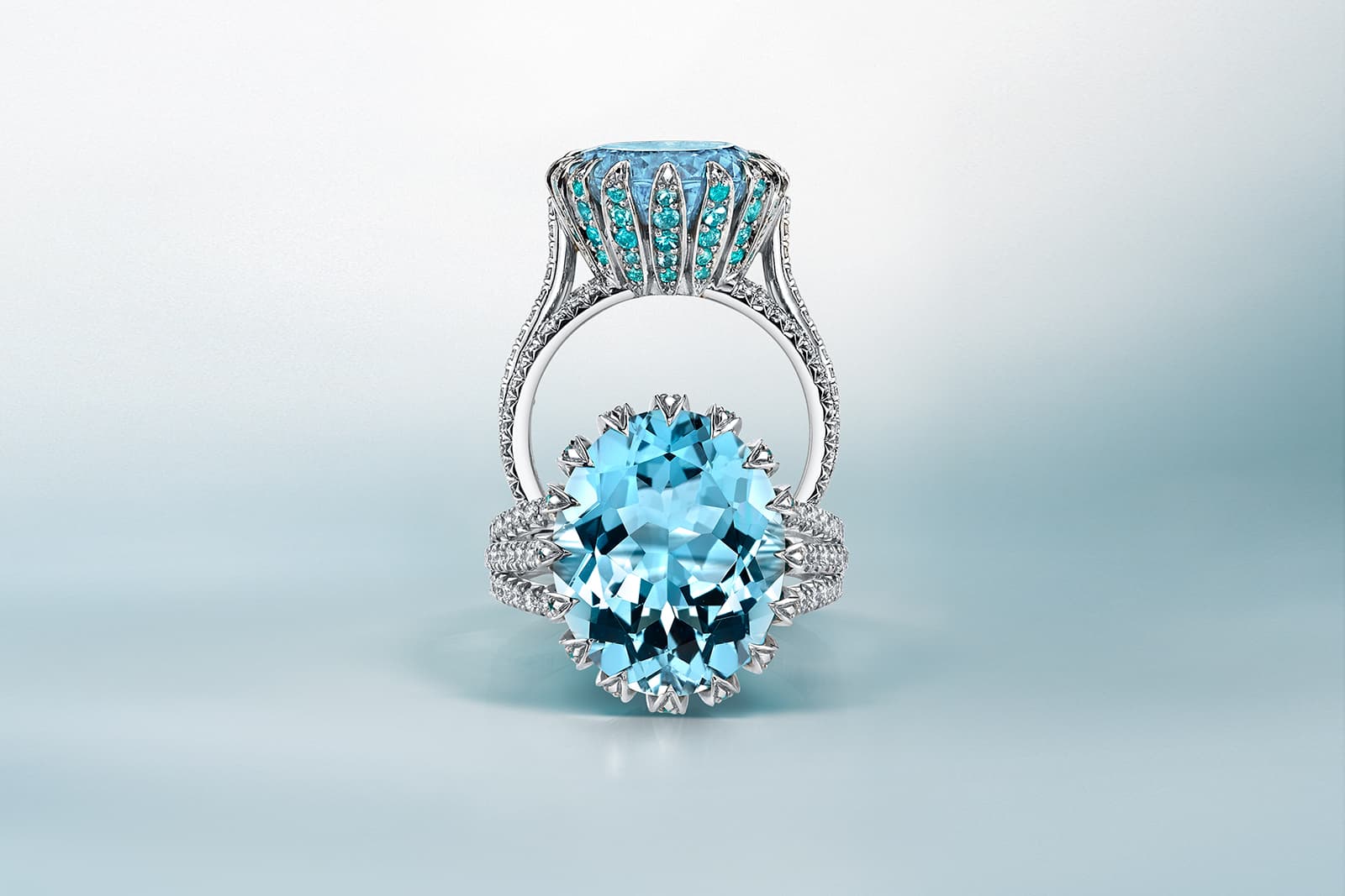 Omi Privé ring with an aquamarine centre stone surrounded by diamonds