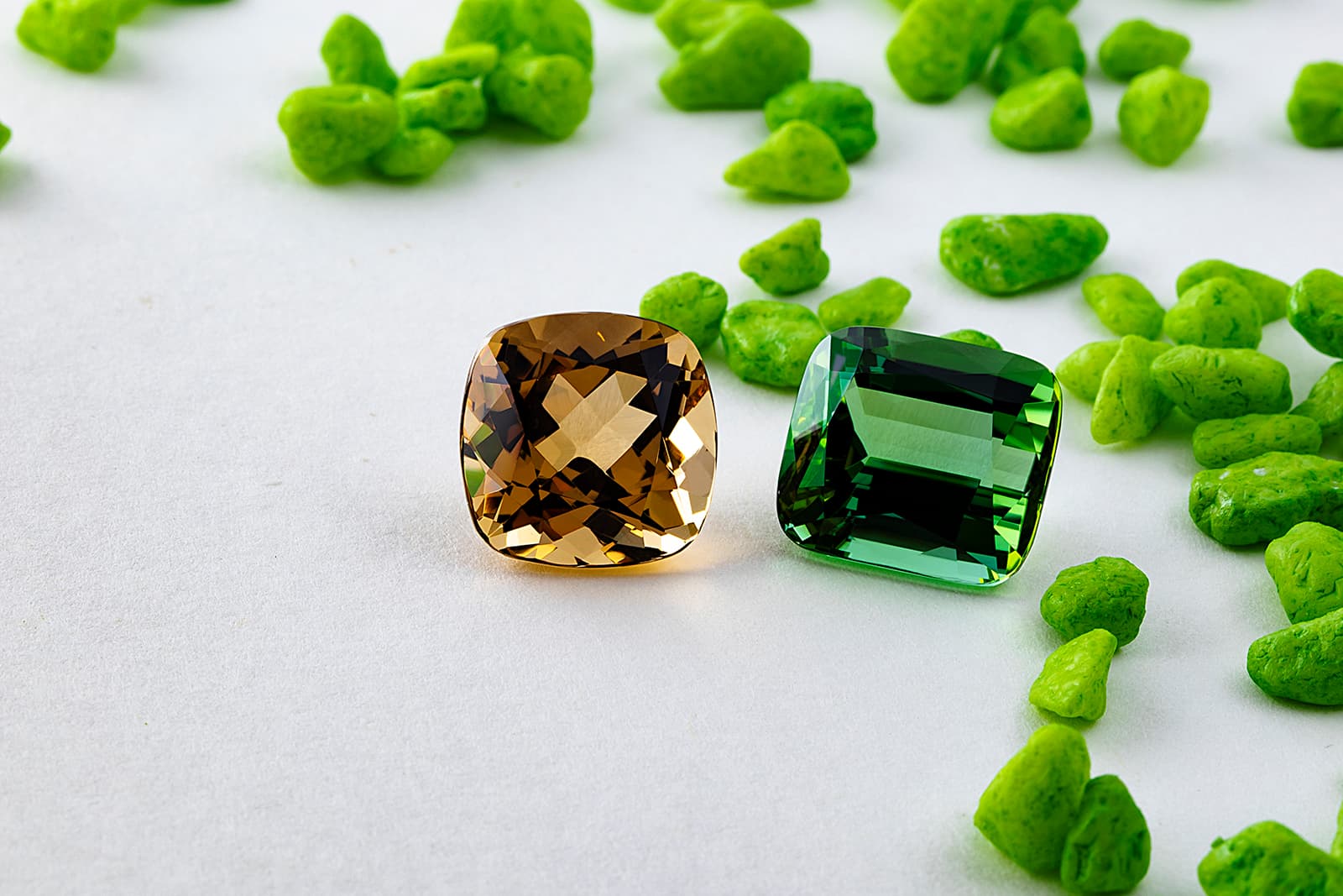 An 11.43 carat beryl and a 14.39 carat tourmaline from Gebrüder Meelis