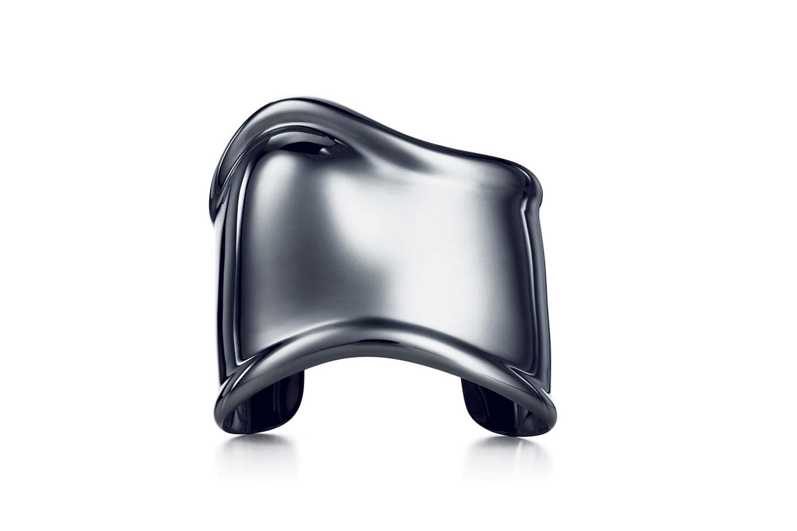  Elsa Peretti famously used unconventional materials in her designs for Tiffany & Co. This contemporary Bone cuff is crafted in copper with a black finish