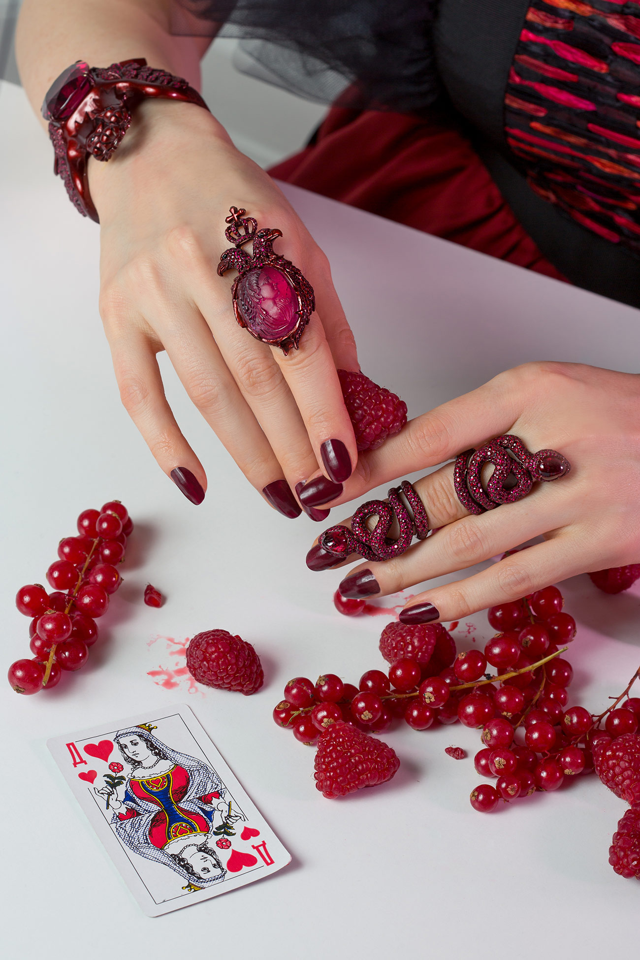 Lydia Courteille cuff in 18k gold with 729 rubies, black spinels and a 90 carat rubellite tourmaline; Catherine II ring in 18k gold with 359 rubies of 6.78 carats, four black spinels and a 37.2 carat red tourmaline carved with the image of Catherine the Great of Russia; Red Snake ring with 722 rubies of 7.25 carats and spinels, all from the Scarlett Empress Collection.