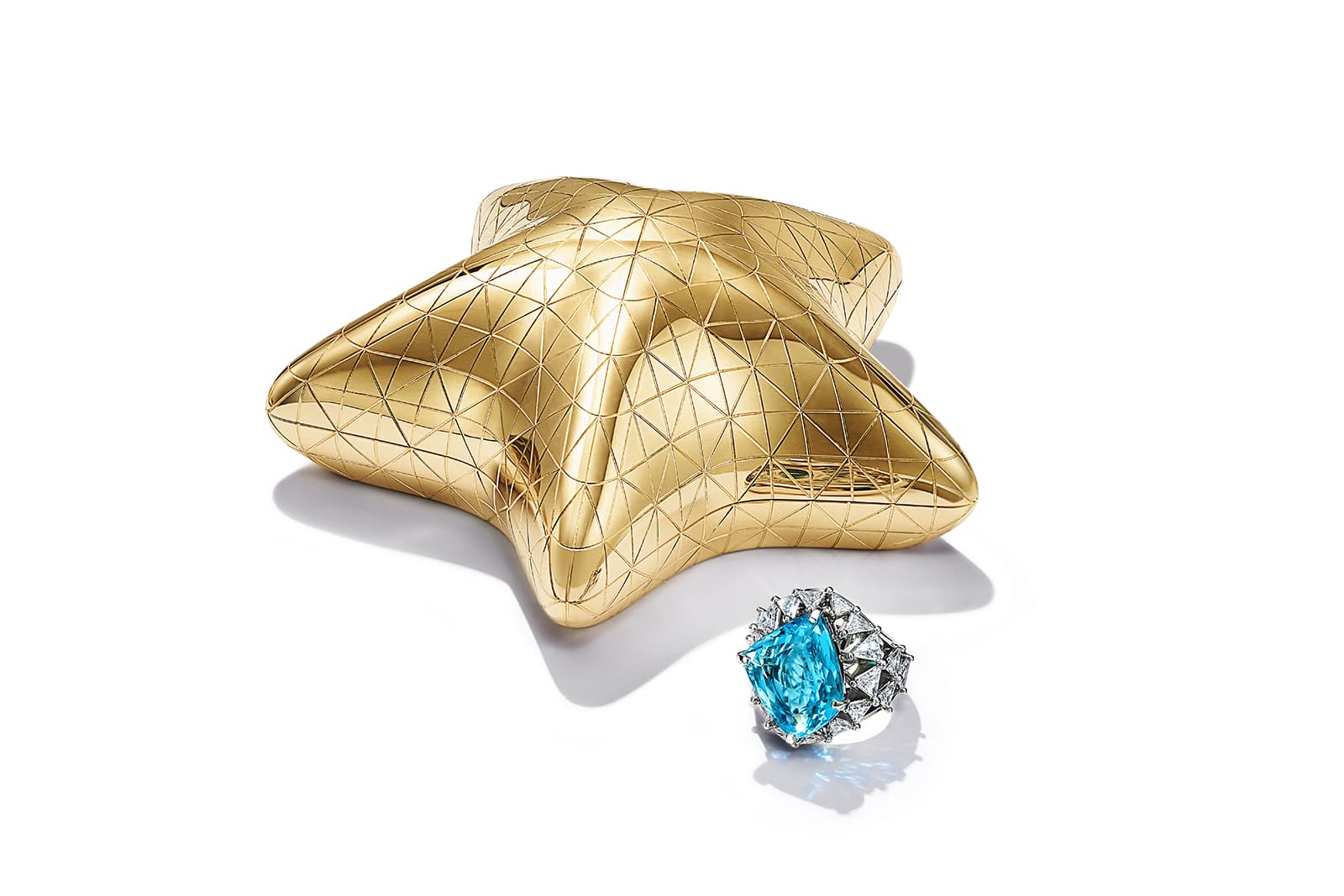  Tiffany & Co. Sea ring with a freeform blue cuprian elbaite tourmaline of over 11 carats and trillion-cut diamonds with an 18k yellow gold case from the Colors of Nature High Jewellery Collection