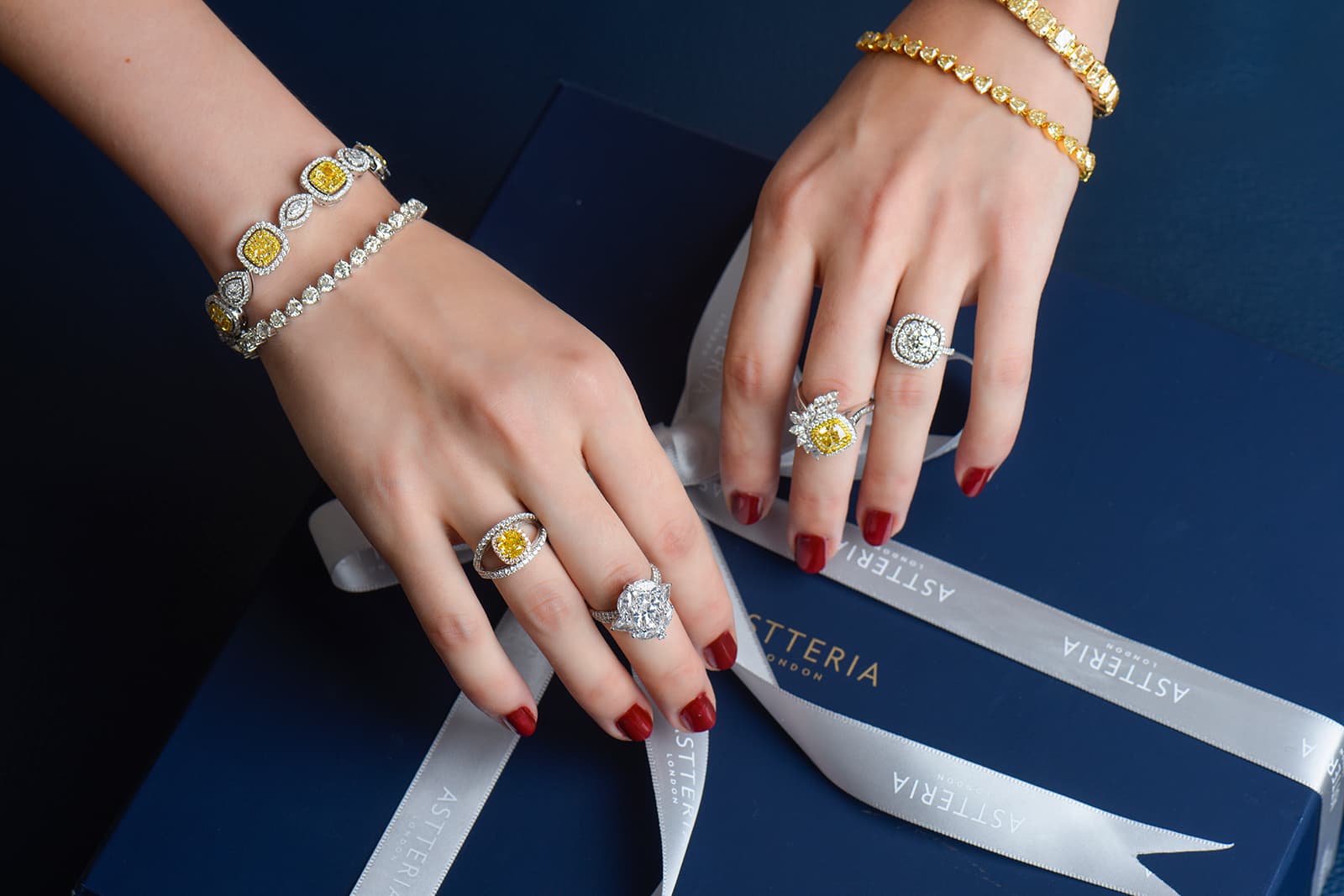 A selection of yellow and white diamond cocktail rings and bracelets by Astteria