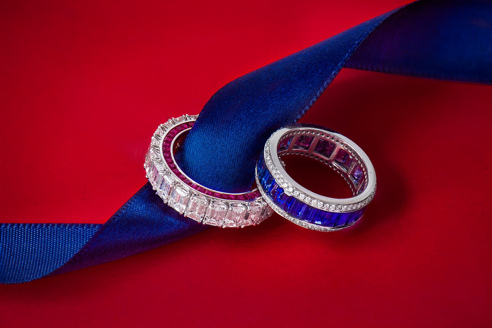 Astteria full eternity rings with emerald-cut diamonds and 2 carats of rubies (left) and 4.80 carats of blue sapphires with a further 0.45 carats of white diamonds