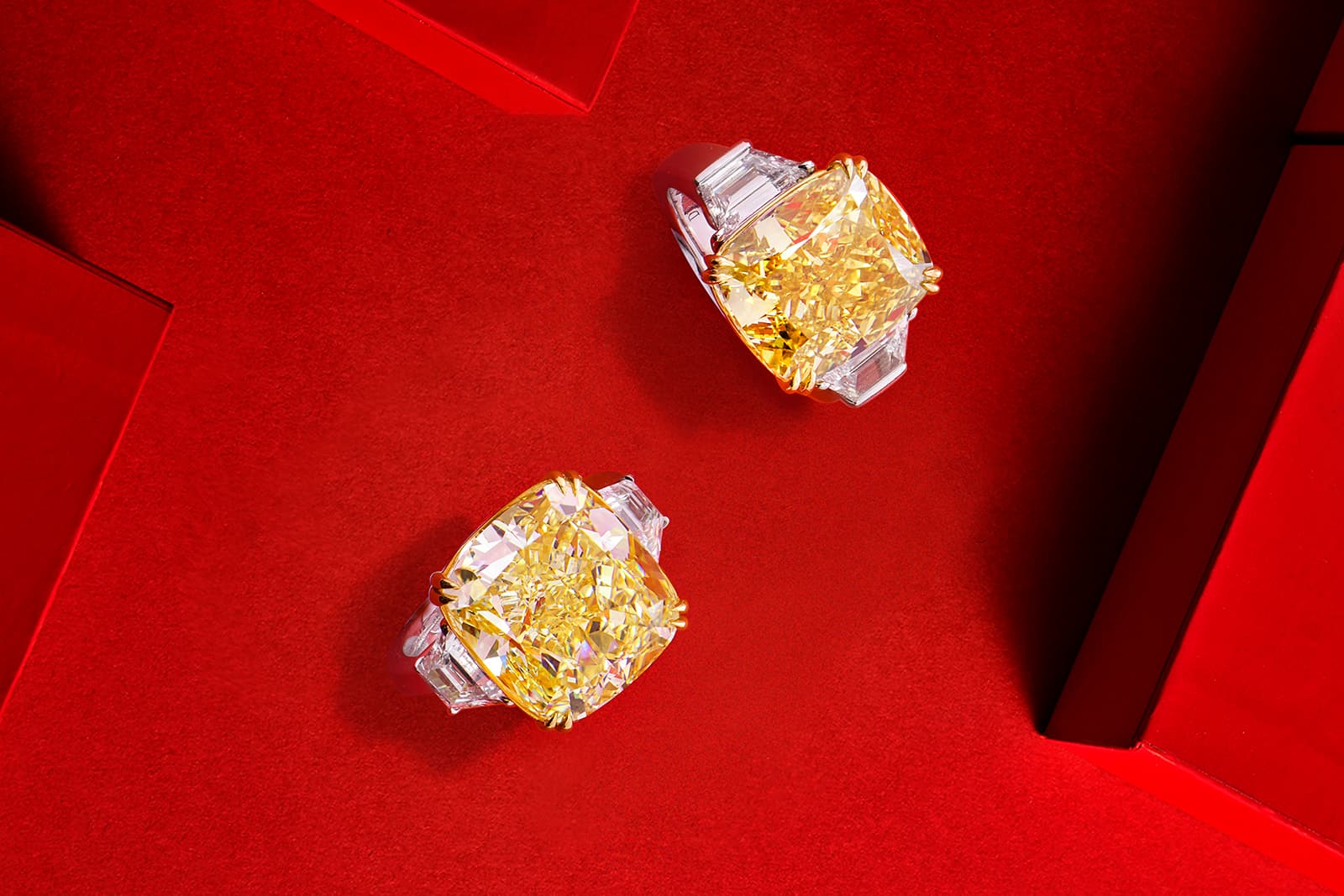  Astteria yellow diamond rings with 15 carat and 12 carat centre stones flanked by white diamonds