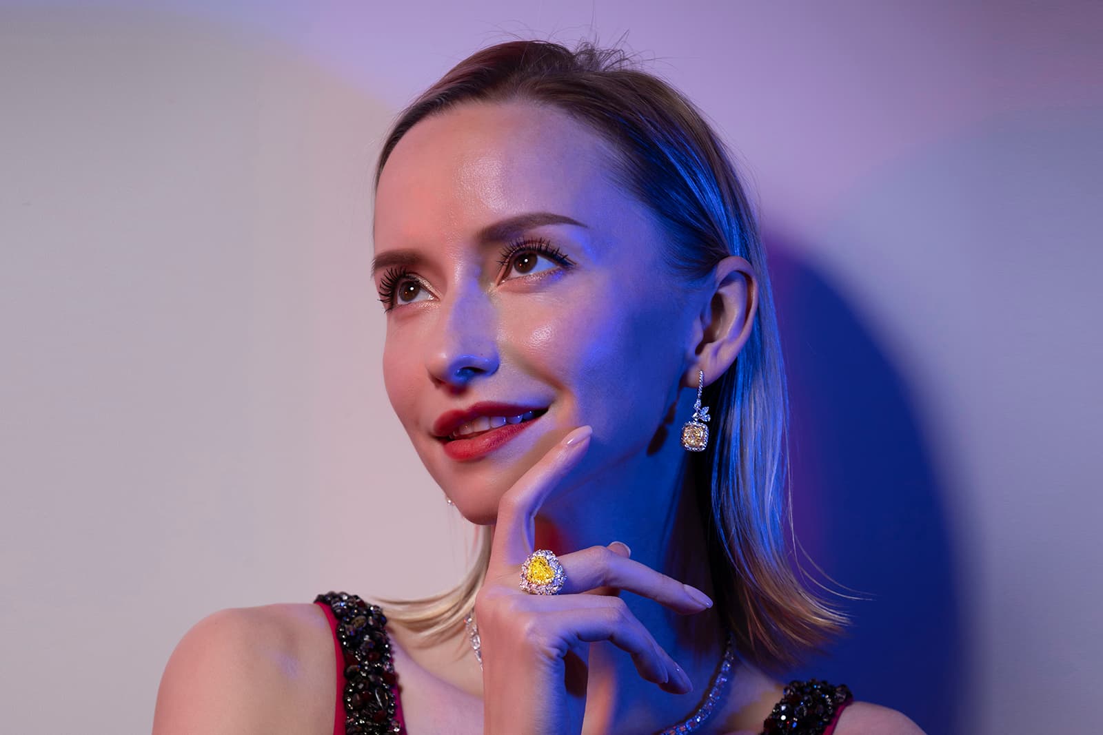  Astteria earrings with 10 carats of light yellow diamonds and white diamonds and a matching ring with a 5 carat vivid yellow diamond surrounded by four carats of pear-shaped diamonds