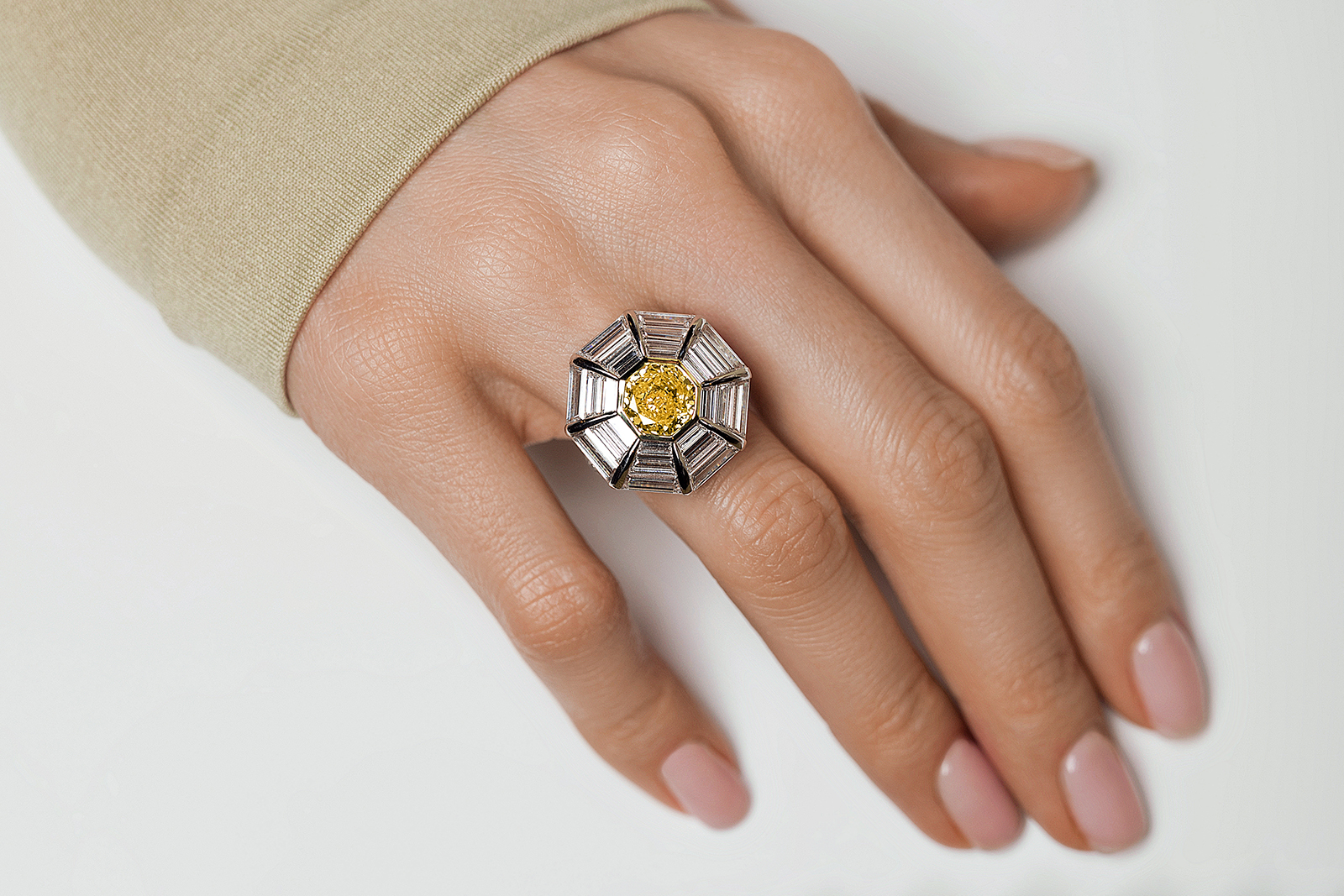 Izmestiev Diamonds Chamomile ring with an octagon-shaped fancy intense orange-yellow diamond of 2.66 carats and more than 5 carats of custom-cut baguette diamonds, set in white gold 