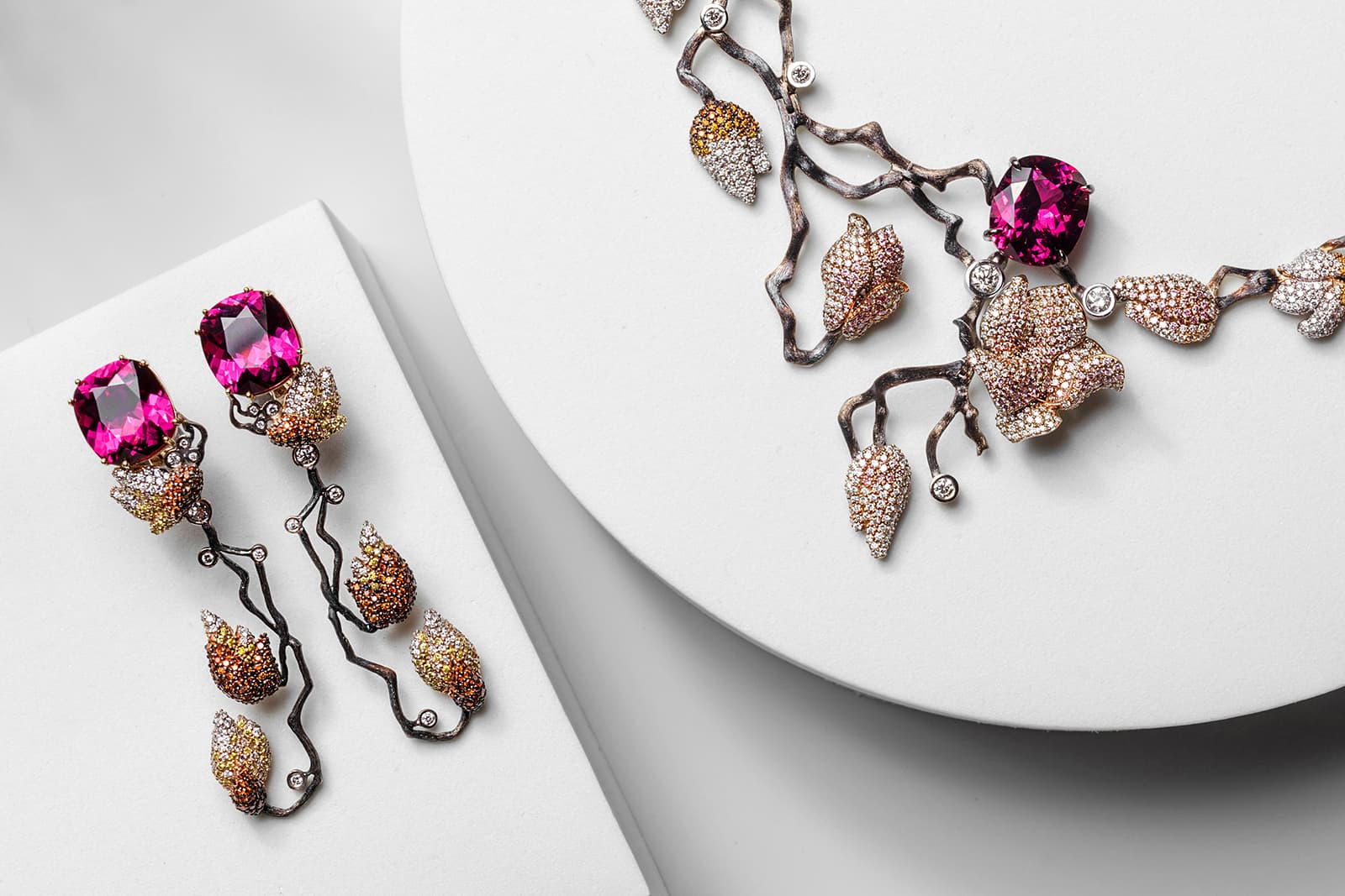 Izmestiev Diamonds Magnolias transformable gold earrings with rhodolite garnets and cognac, yellow and white diamonds, and the Magnolia necklace in coated gold with rubellite and white, yellow, cognac and pink diamonds from the Japanese Garden Collection