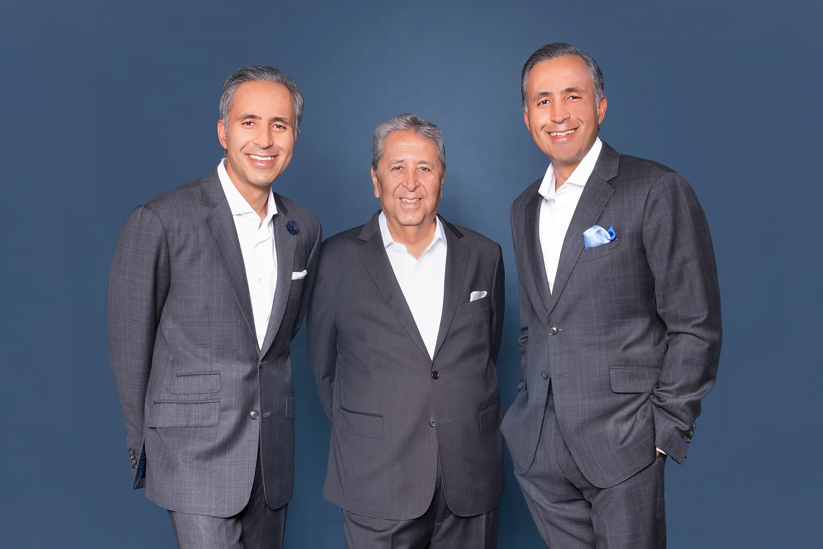 Mr. Papu Butani and his sons, identical twins Manoj and Mukesh Butani