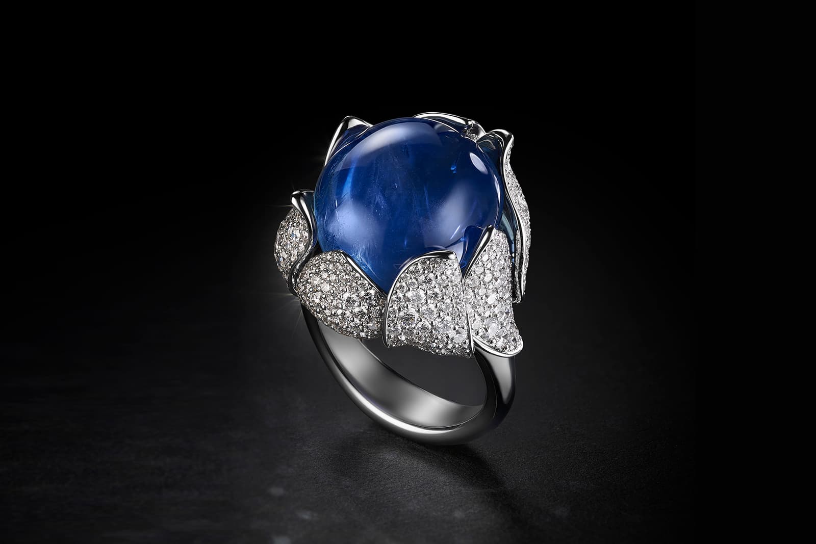 House of Geneva Vielle-Ville Numéro 4 ring with an unheated Burmese double cabochon sapphire of 25.62 carats and diamond petals in white gold