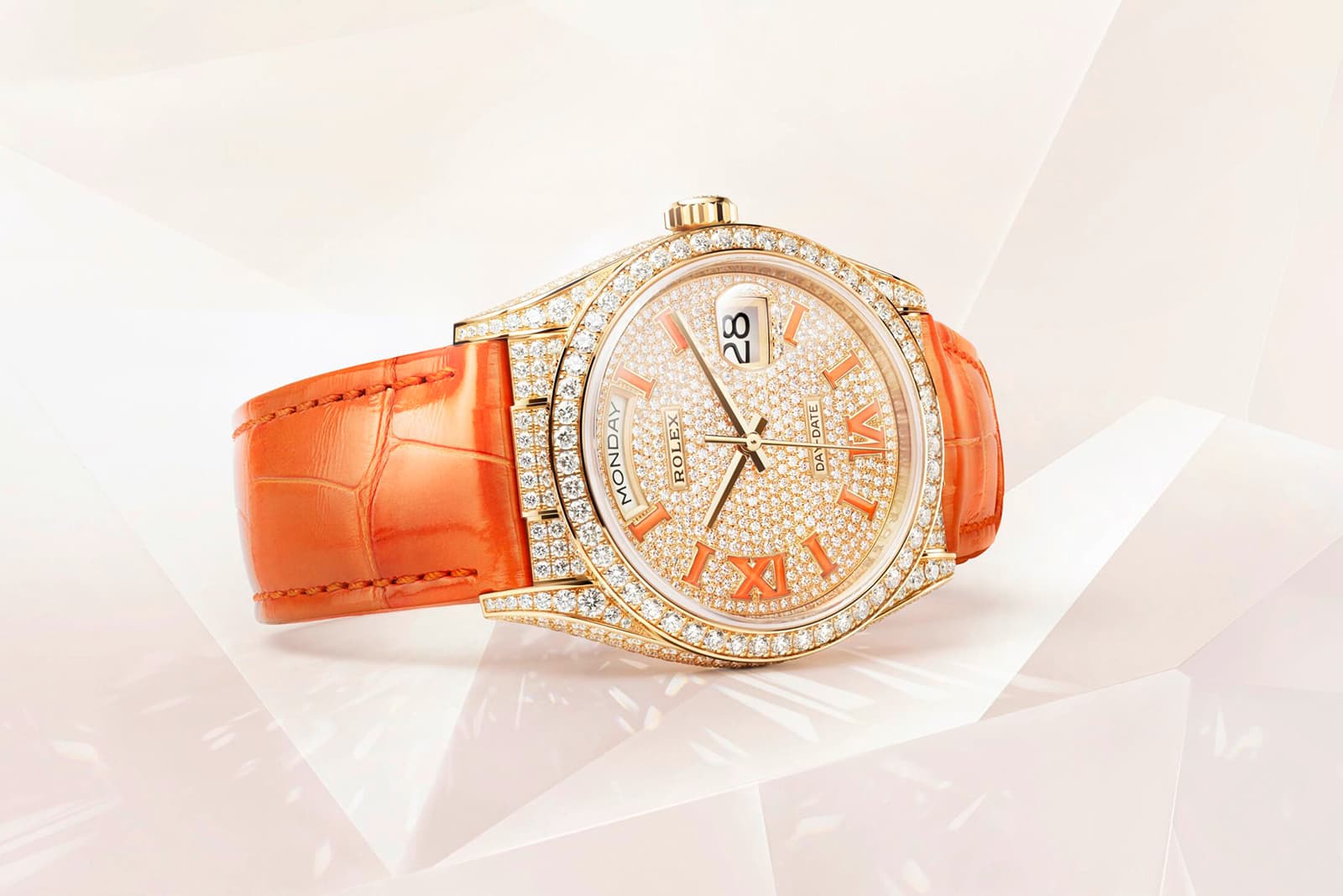 The Rolex Oyster Perpetual Day-Date 36 with a coral orange alligator leather strap, coral enamel hour markers and 817 diamonds, including an entirely pavé set dial 