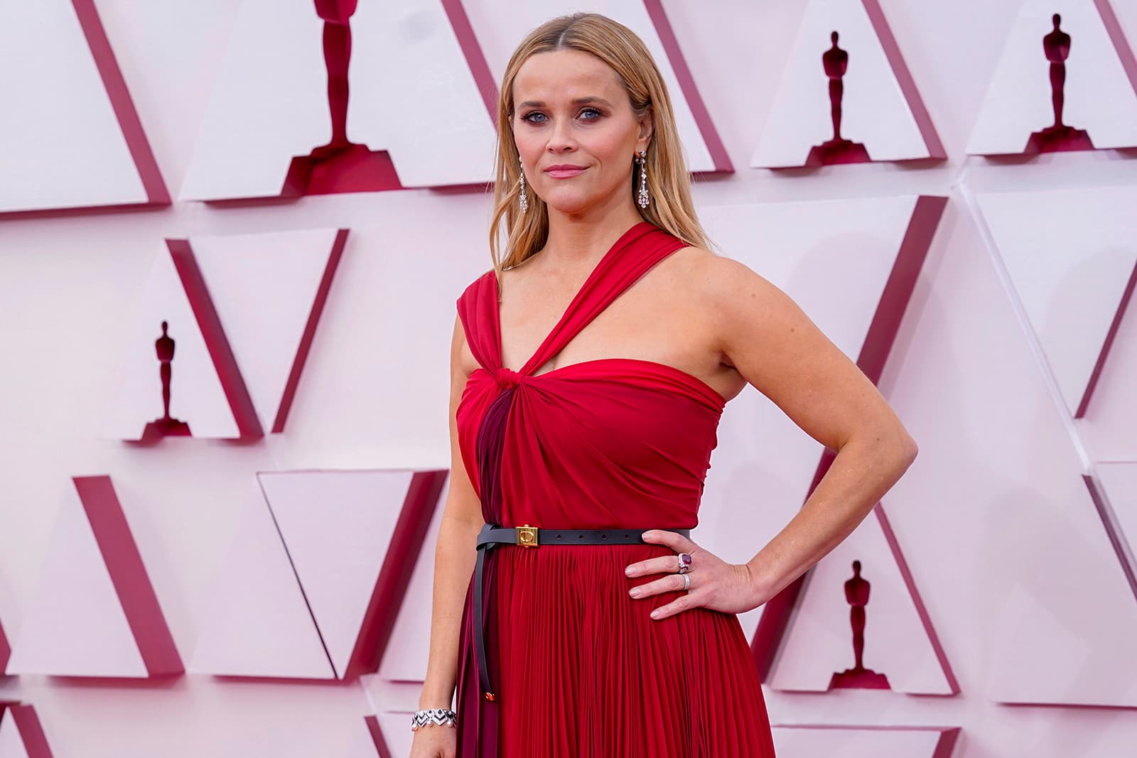 Reese Witherspoon in Bulgari High Jewellery at the Oscars 2021 wearing 11.74 carats of rubies and a Barocko High Jewellery bracelet