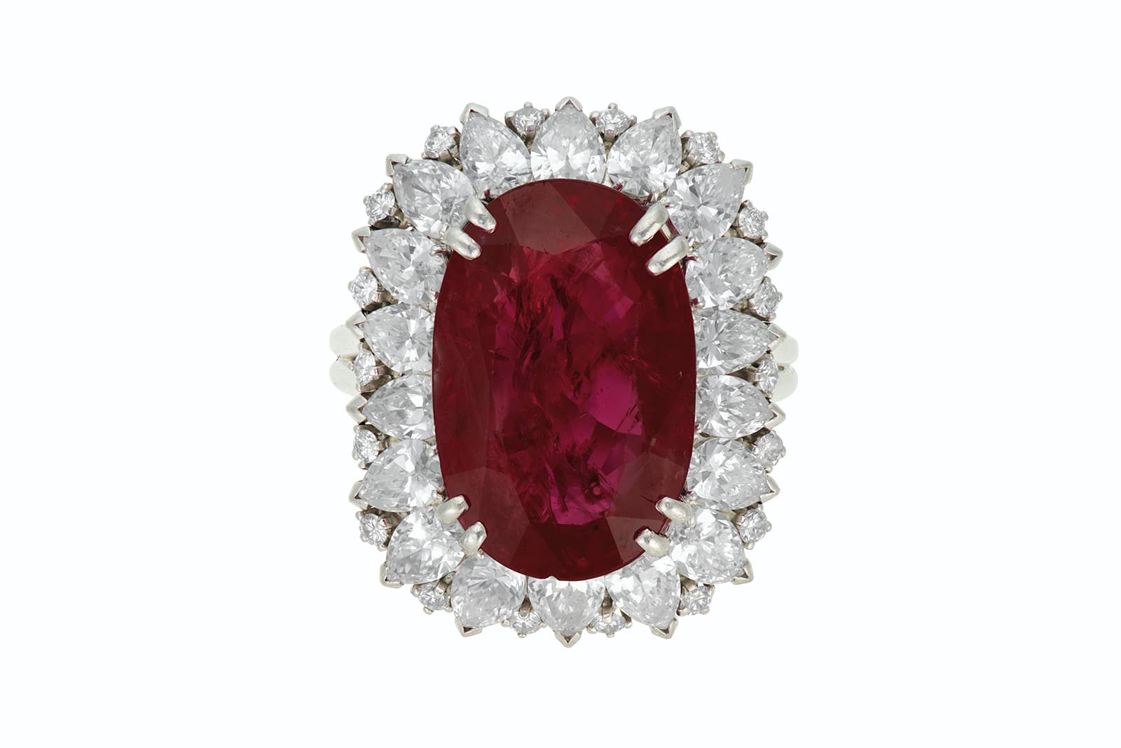  Harry Winston ring with an oval mixed-cut ruby of 14.01 carats, surrounded by pear and round diamonds set in platinum (circa. 1968), sold by Christie's