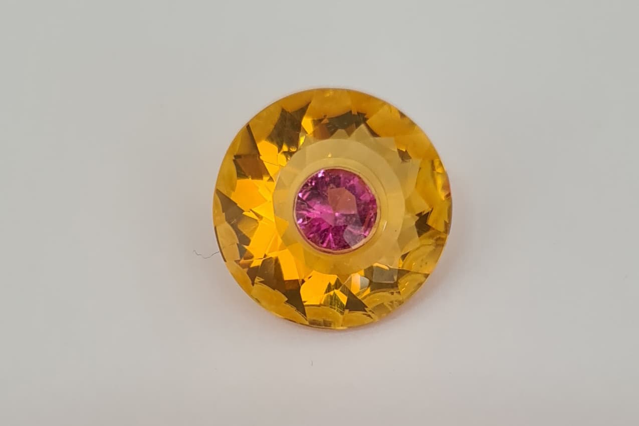  Carved fire opal set with a pink tourmaline for a total weight of 9.41 carats by Fredh Jhones