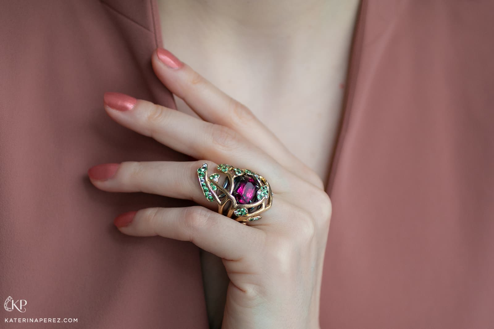   This ring by Maison Alix Dumas is inspired by the symbolic tree of life with a rhodolite garnet surrounded by ‘foliage’ set with pale green tsavorite garnets 