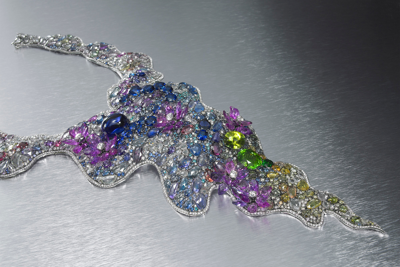 Anna Hu Waterlilies necklace inspired by the paintings of Claude Monet with a 5.22 carat tanzanite cabochon, 11 sapphires weighing 41.5 carats, tsavorites, tourmalines, morganites, alexandrites, Paraiba tourmalines, natural pastel-colored sapphires and diamonds for a total weighing 630.17 carats