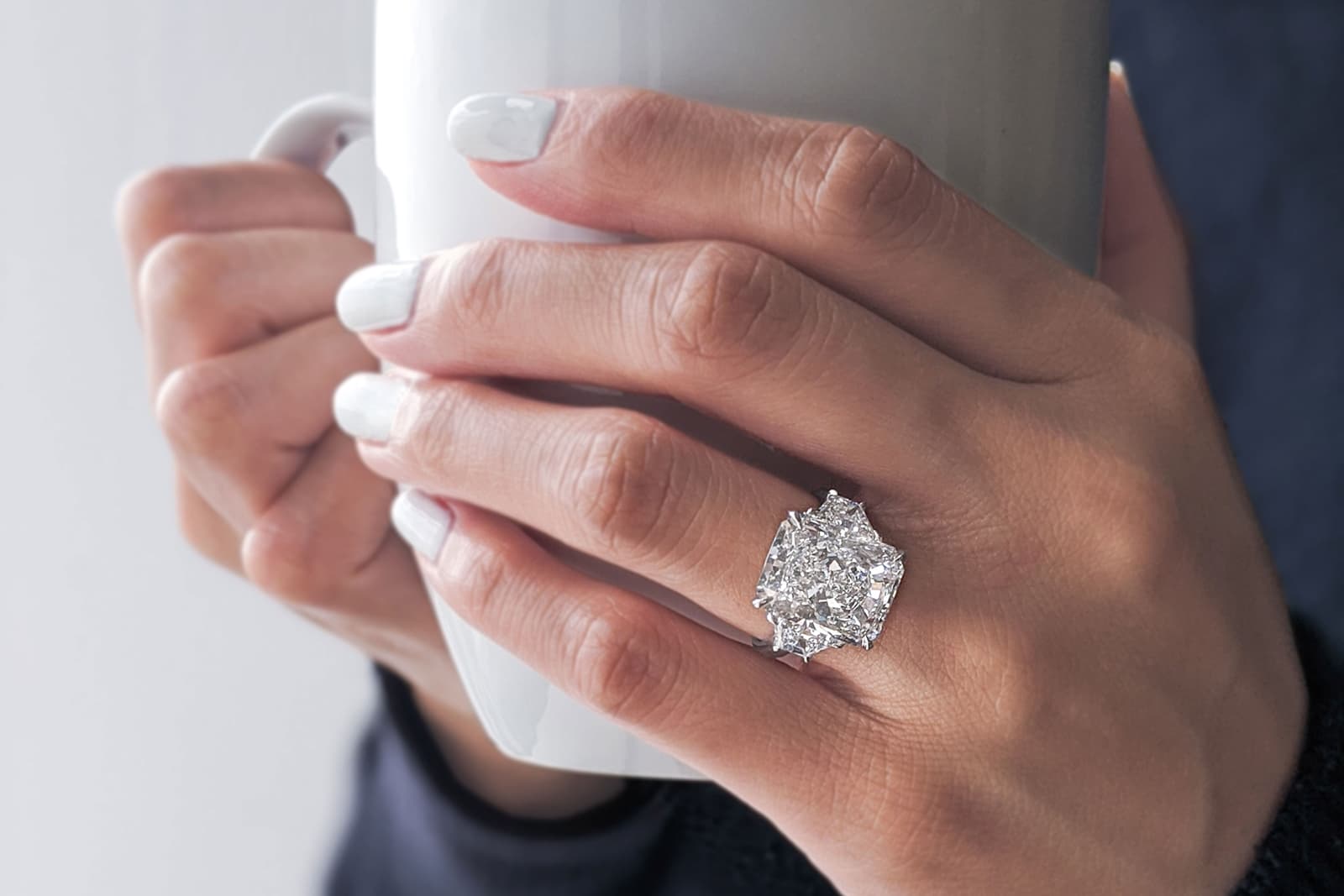  Norman Silverman three-stone diamond engagement ring 
