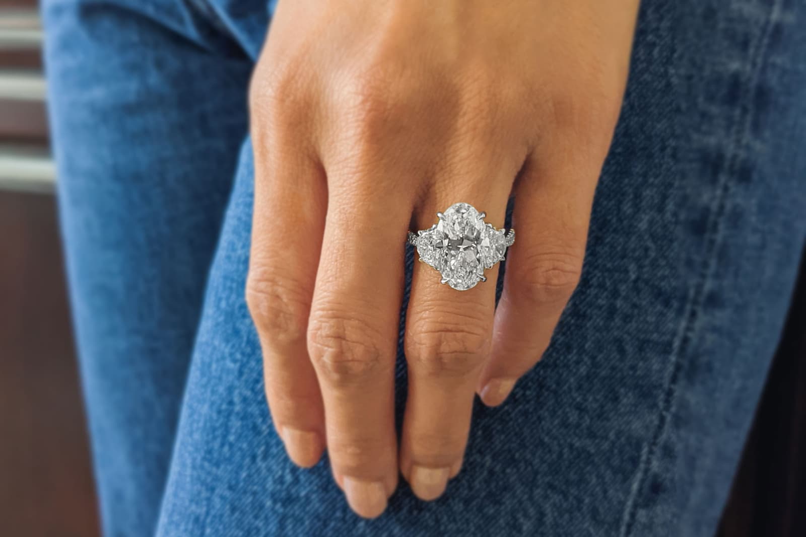 Norman Silverman oval-shaped diamond engagement ring with diamond side stones