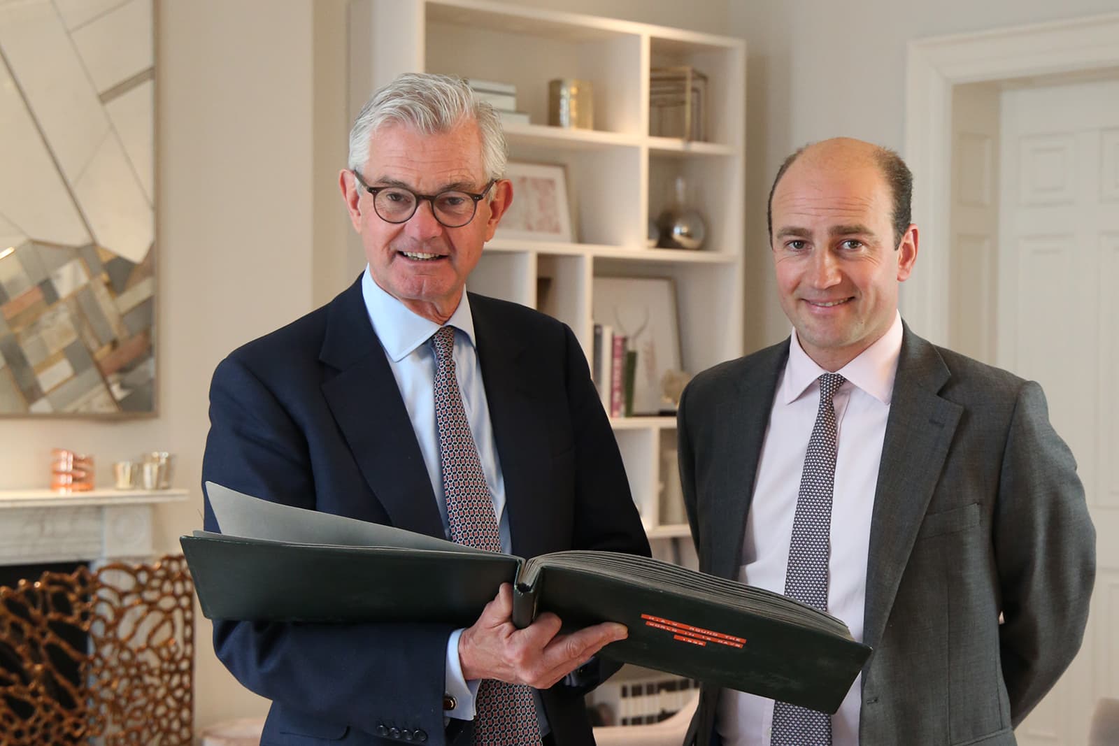 Michael Wainwright and James Amos, Directors of Boodles, browsing through the original ‘Around the World in 16 Days’ photo album