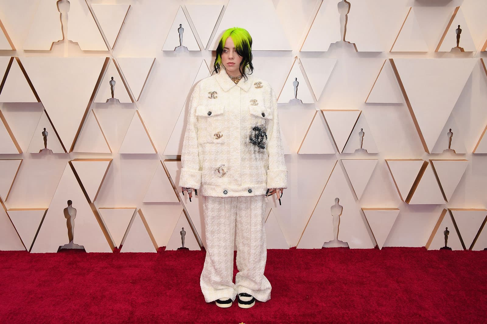  Singer Billie Eilish demonstrating her signature style at the 2020 Oscars in a white Chanel suit