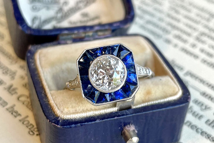  Jack Weir & Sons 1.37 carat Art Deco-inspired diamond engagement ring with a sapphire halo