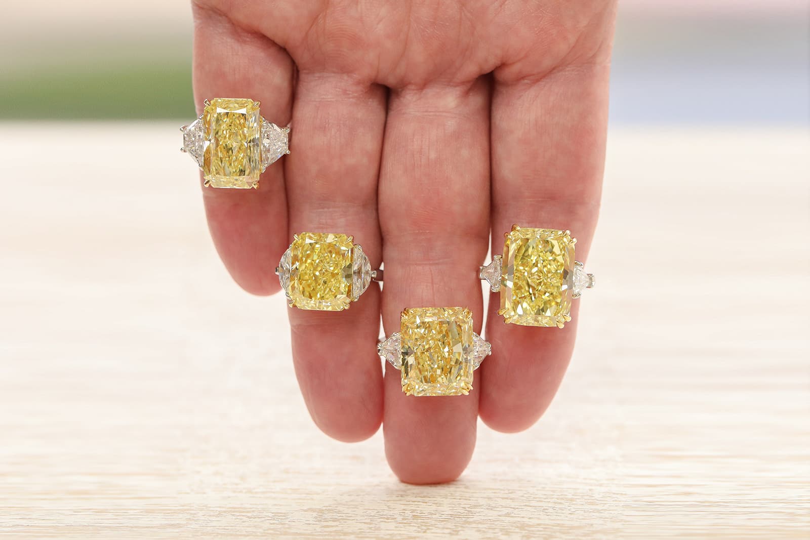 A quartet of fancy yellow diamond rings by IceRock Diamonds, based in Los Angeles, California