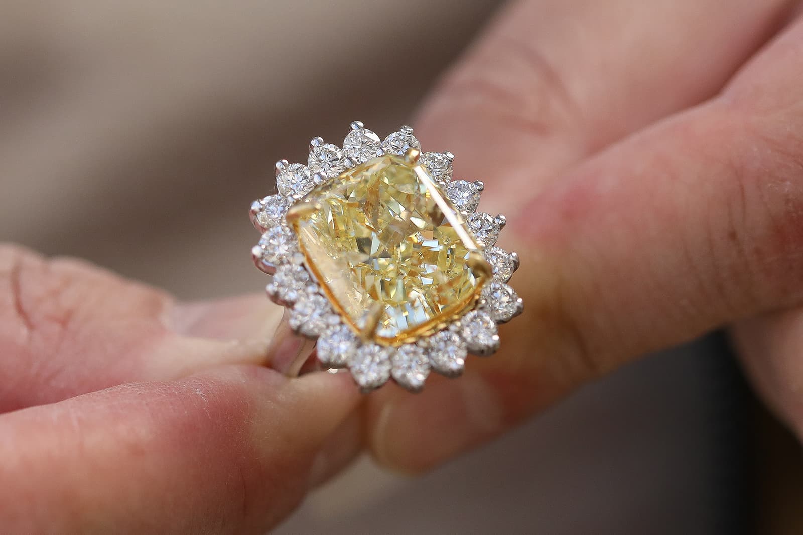  IceRock Diamonds ring with a central yellow diamond surrounded by round brilliant-cut colourless diamonds