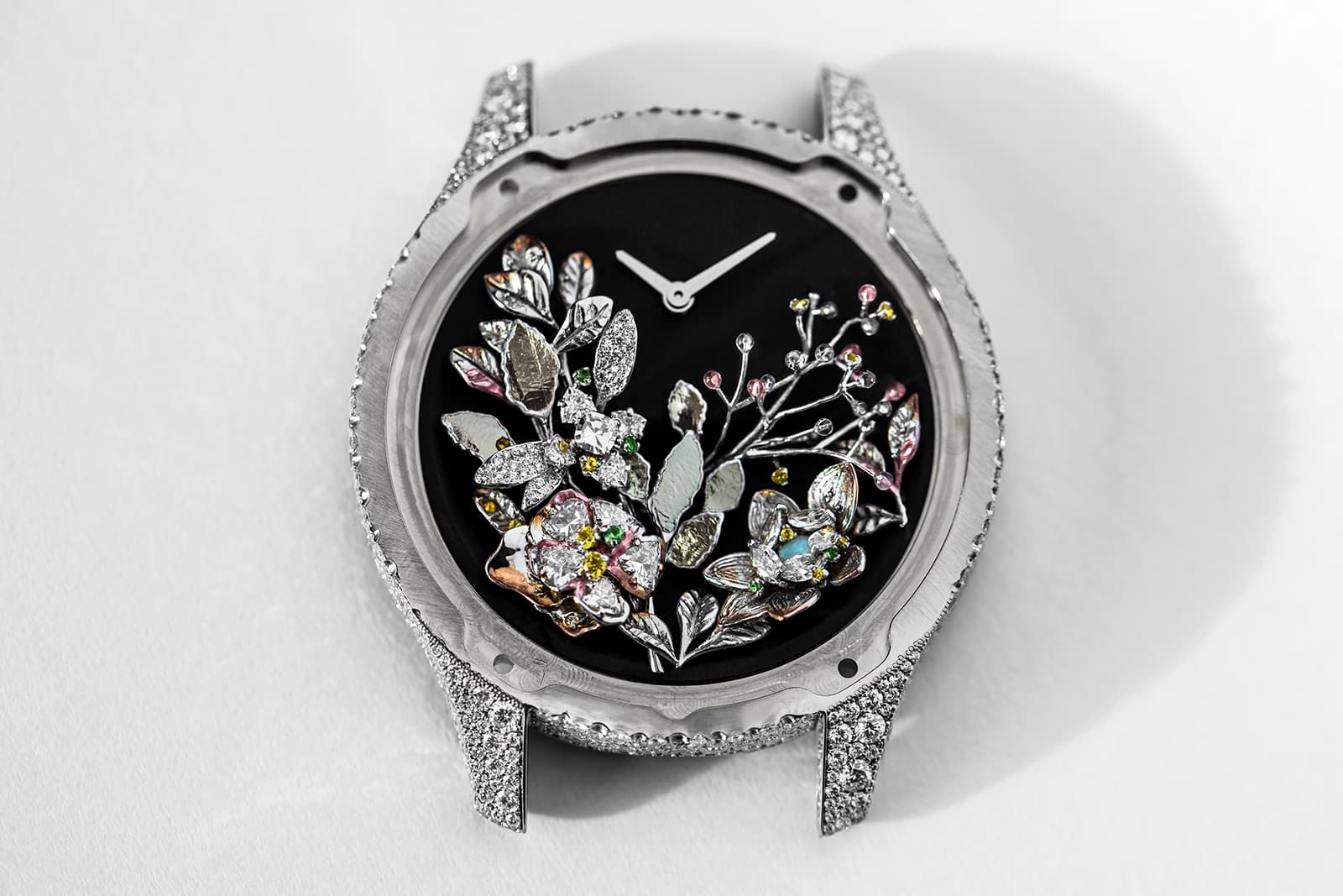  A striking white Dior Grand Soir Jardins de Nuit watch with a diamond-set bezel and lugs