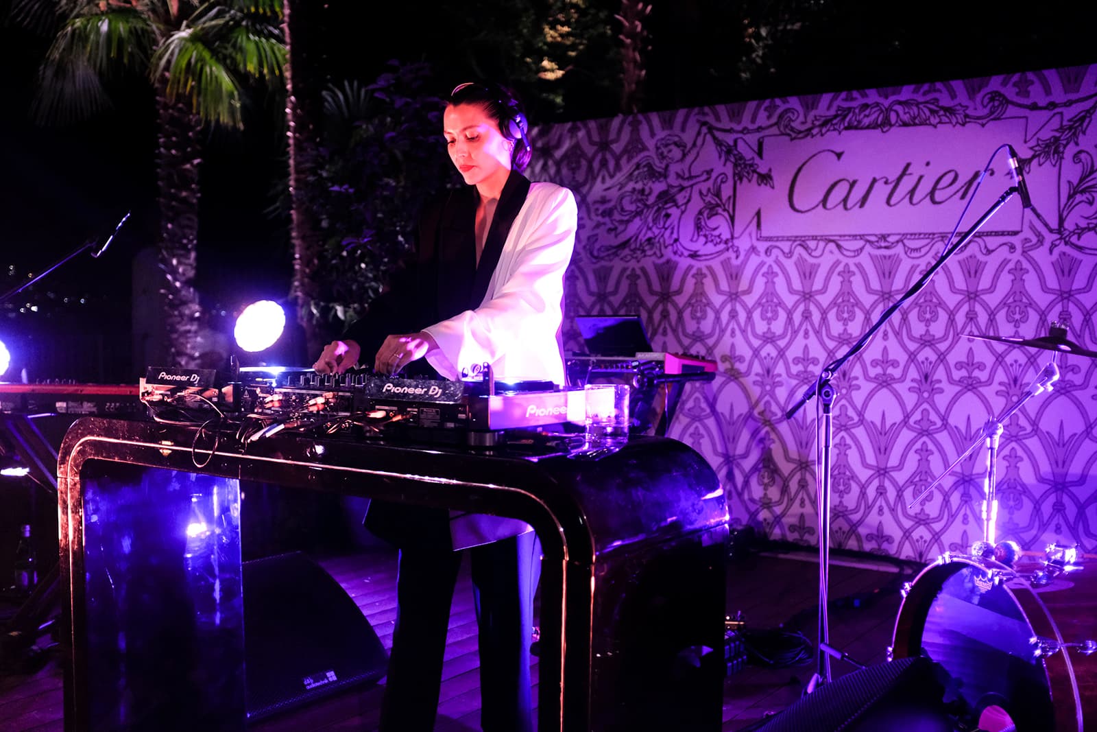  A DJ entertains the crowd at the Sixième Sens par Cartier High Jewellery Collection launch event in Lake Como, Italy 