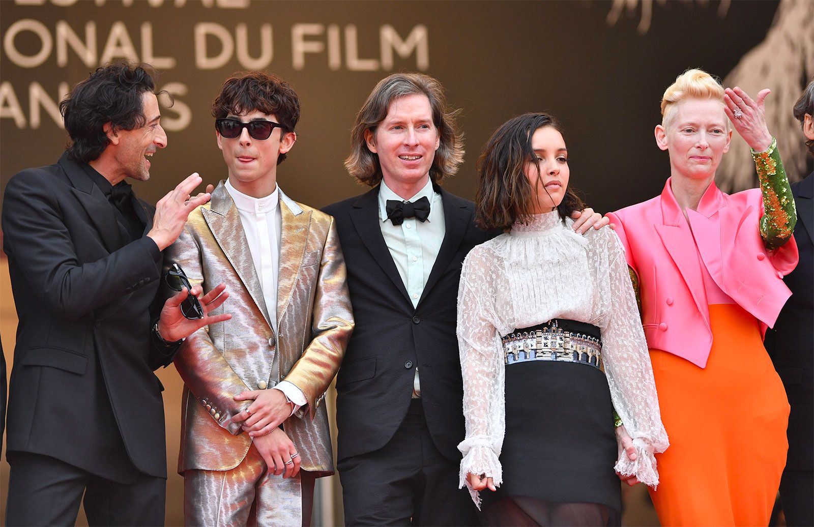 Timothée Chalamet at the Cannes Film Festival 2021 premiere of the French Dispatch wearing a selection of Cartier rings and bracelets