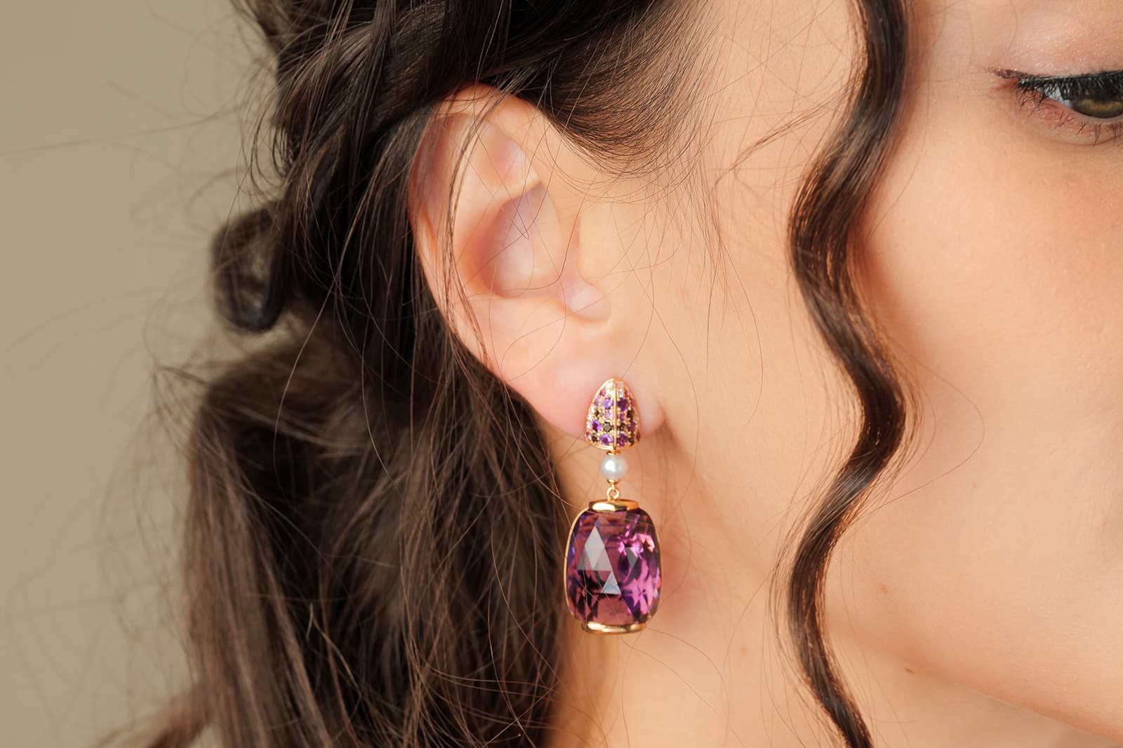  A pair of earrings with large faceted gemstones by Sunita Nahata 