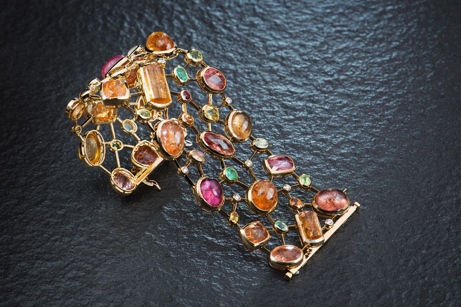  TAYMA Fine Jewellery Cobweb cuff with Imperial topaz, Paraiba tourmalines, sapphires, moonstones, mandarin garnets and diamonds 