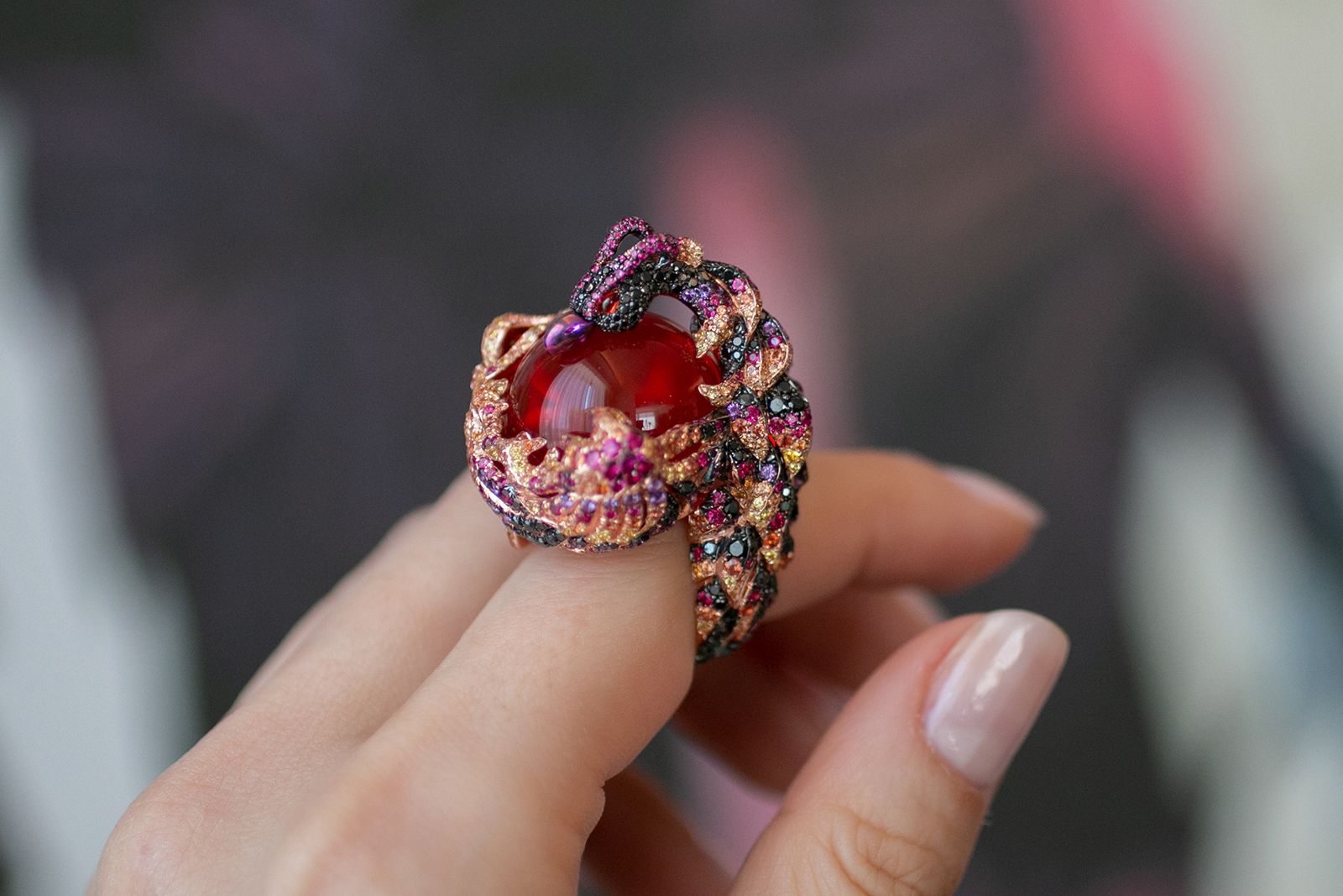Chopard ring from The Red Carpet collection in ethical Fairmined-certified 18k rose gold and titanium with an opal cabochon of 43.46 carats and set with yellow sapphires, orange sapphires, black diamonds, rubies and amethysts 