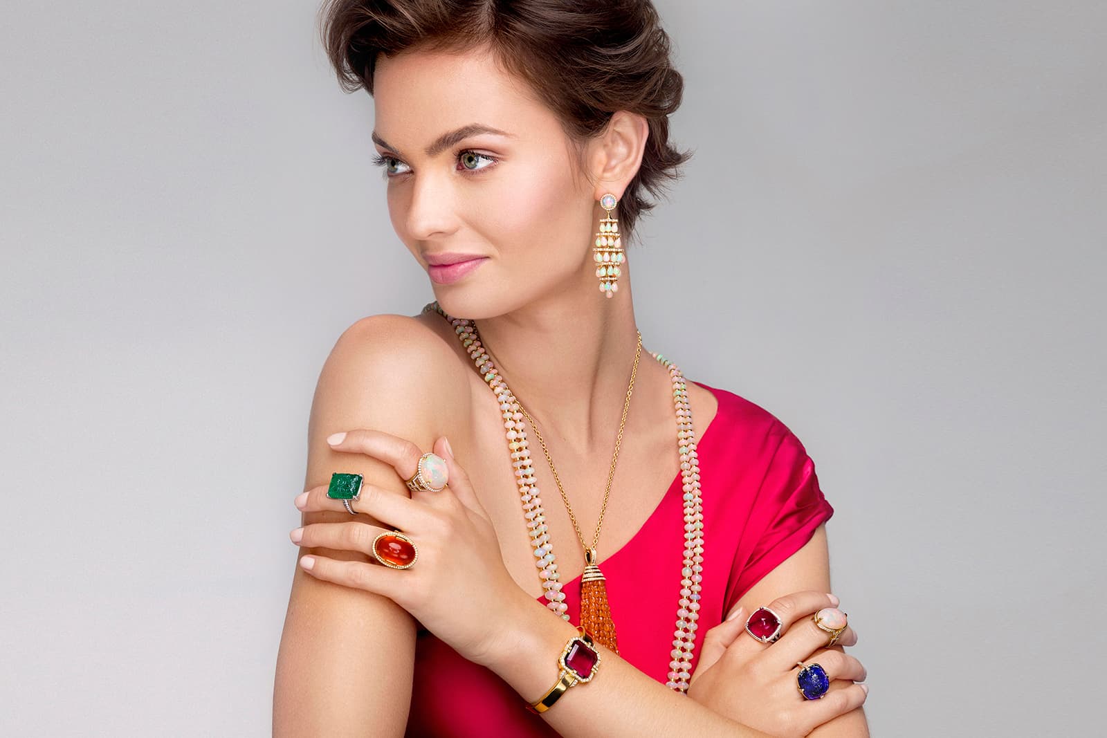 A model wears coloured gemstone creations by Goshwara