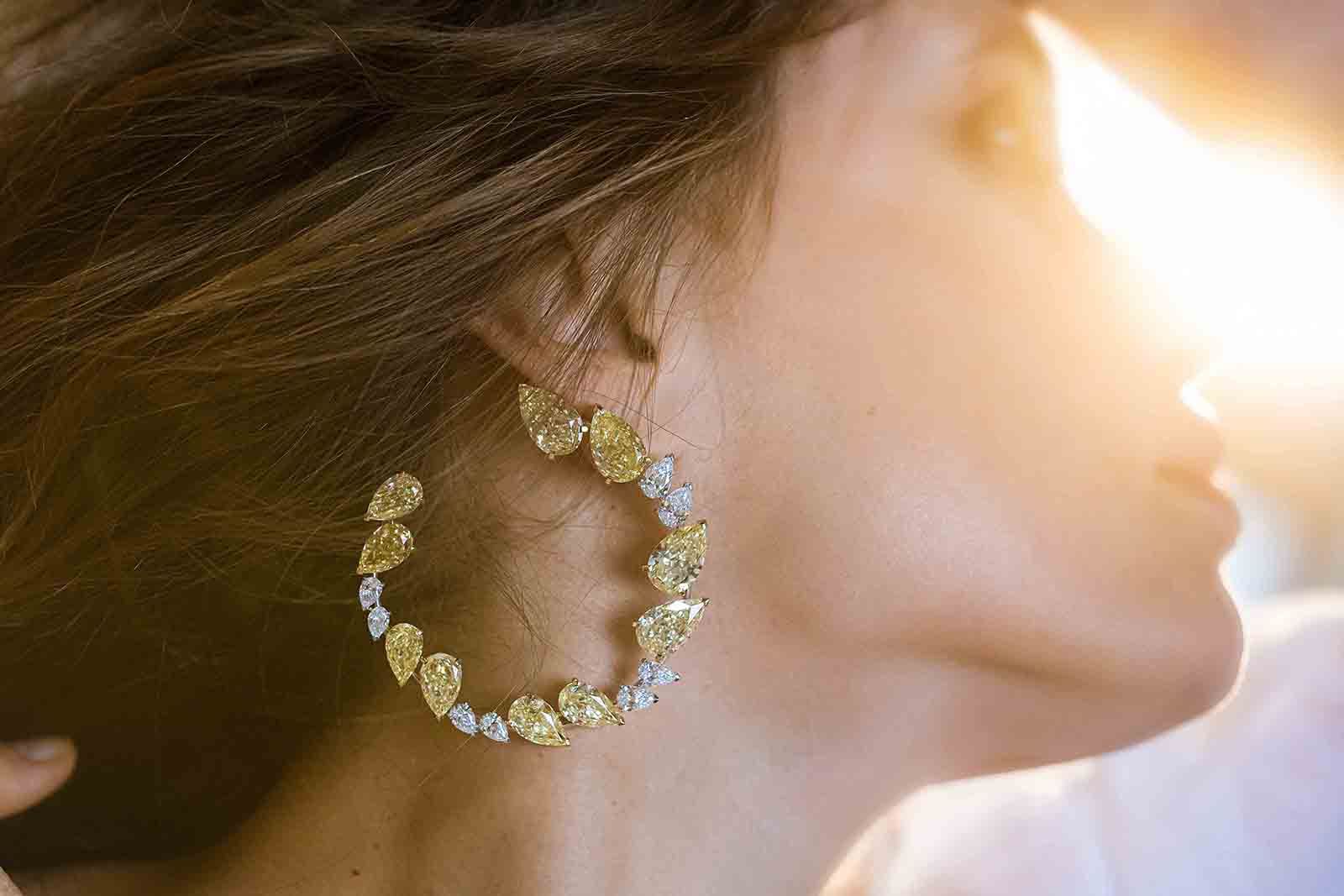 Fanny Sage wears the Pear Lover XXL hoop earring with fancy yellow and colourless pear-shaped diamonds from the Messika Magnetic Attraction High Jewellery collection