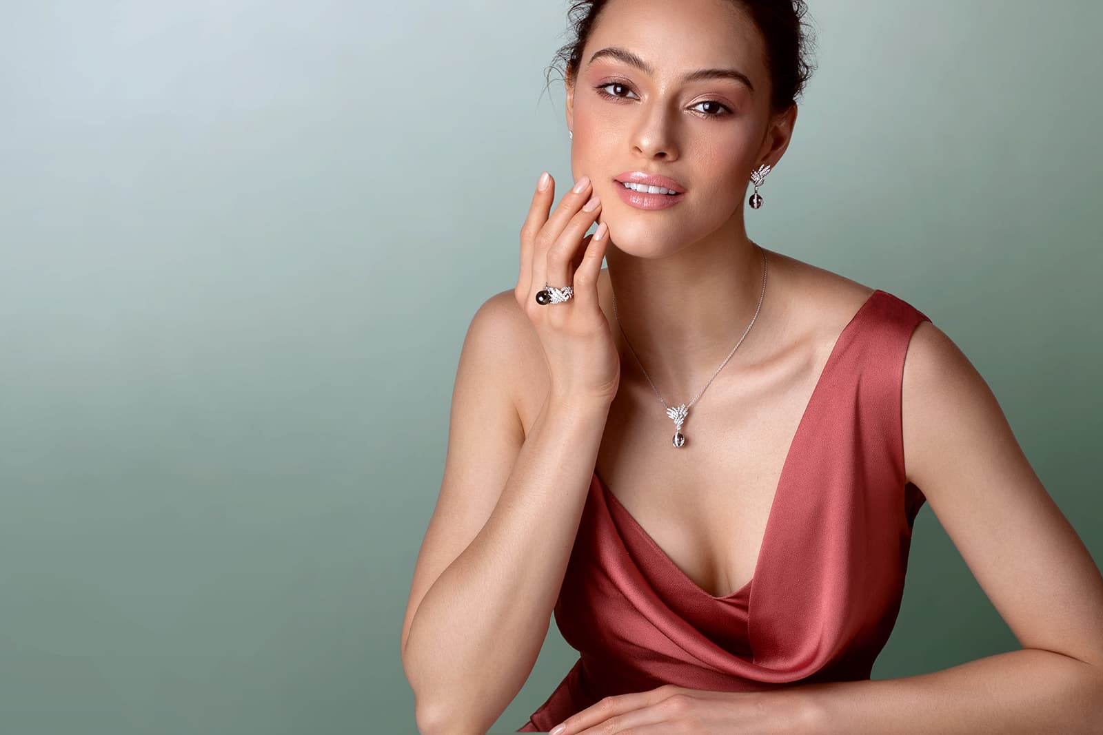 A model wears a necklace, ring and a pair of earrings from the Stenzhorn Bora Bora Collection