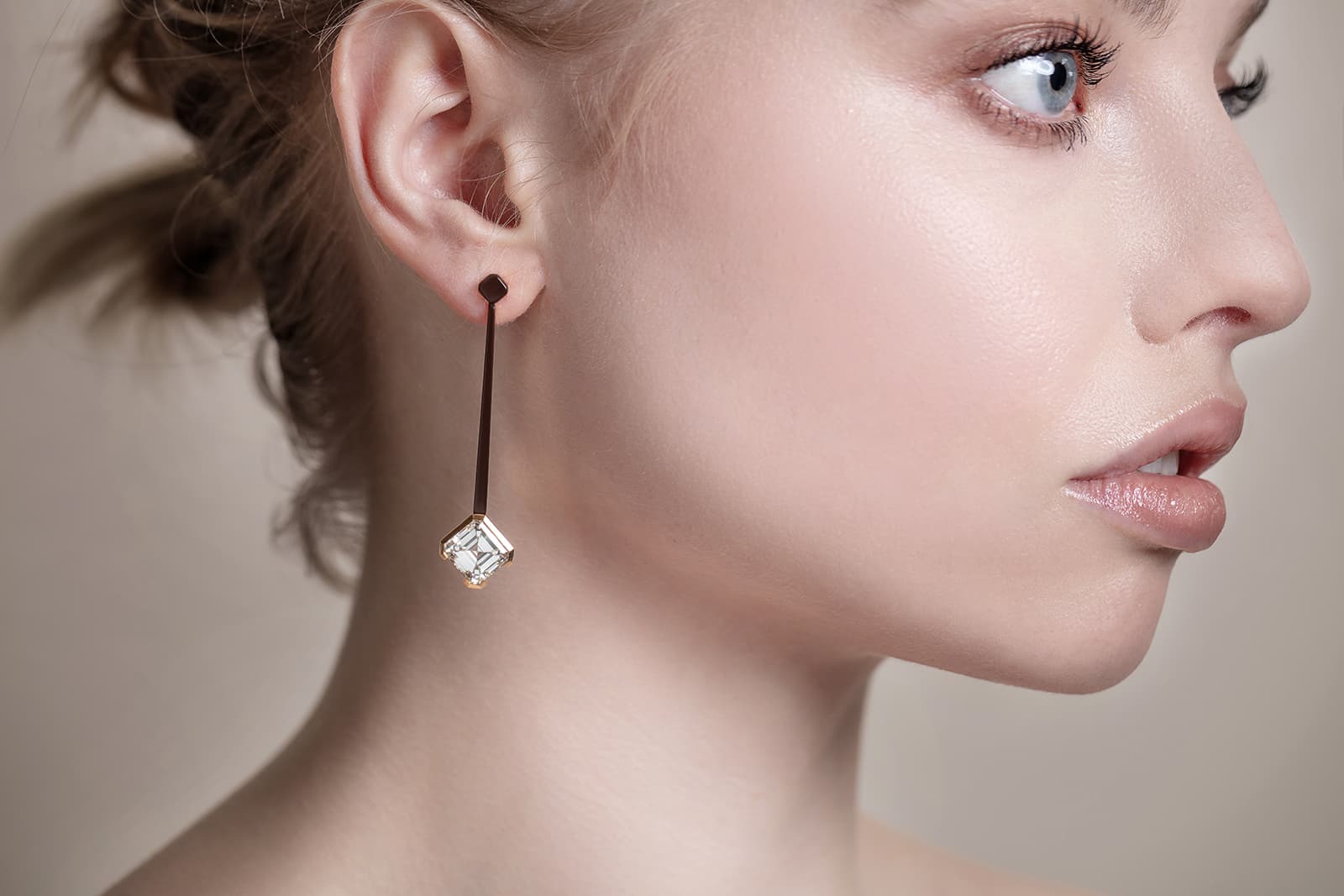 A model wears the Asscher 8 earrings by Thelma West 