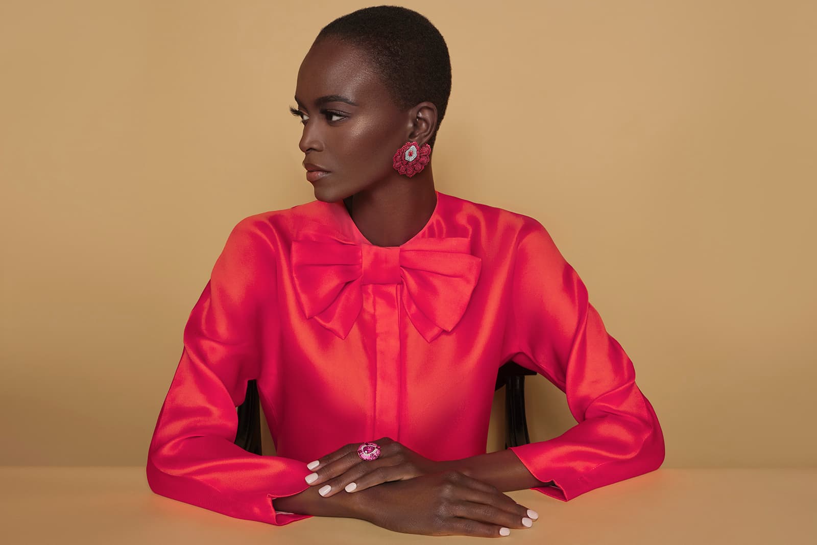 A model wears the Enchanted Garden earrings by VANLELES with Mozambican rubies