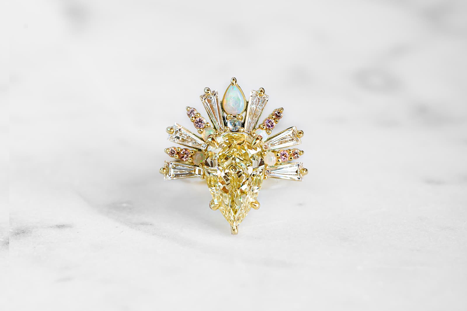  Maggi Simpkins Sunburst ring with a pear-shaped fancy light yellow diamond centre stone with white diamonds, opals, moonstones, peach sapphires and pink tourmalines