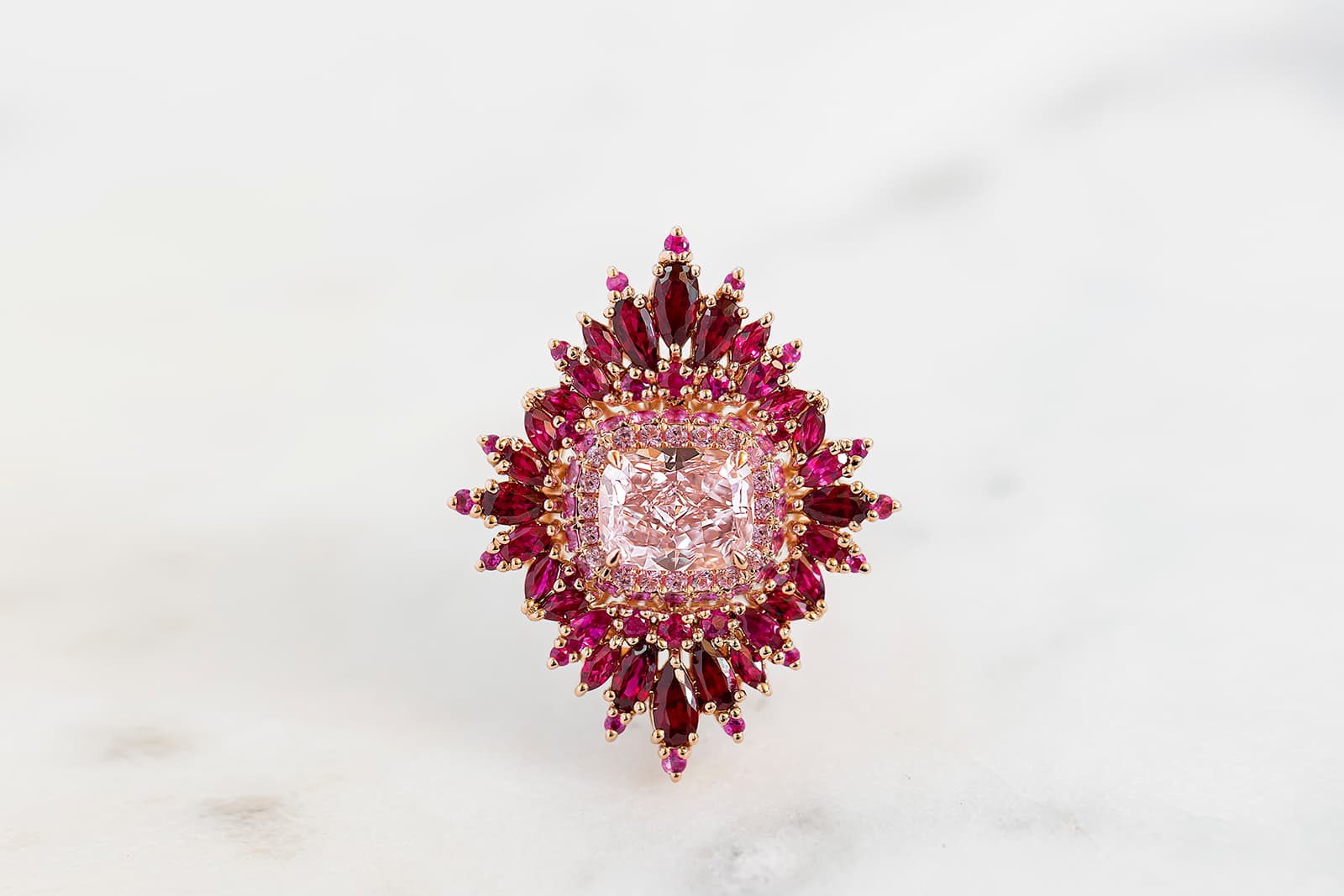  Maggi Simpkins In Bloom ring with a cushion-cut pink diamond centre stone, pink sapphires and custom-cut rubies