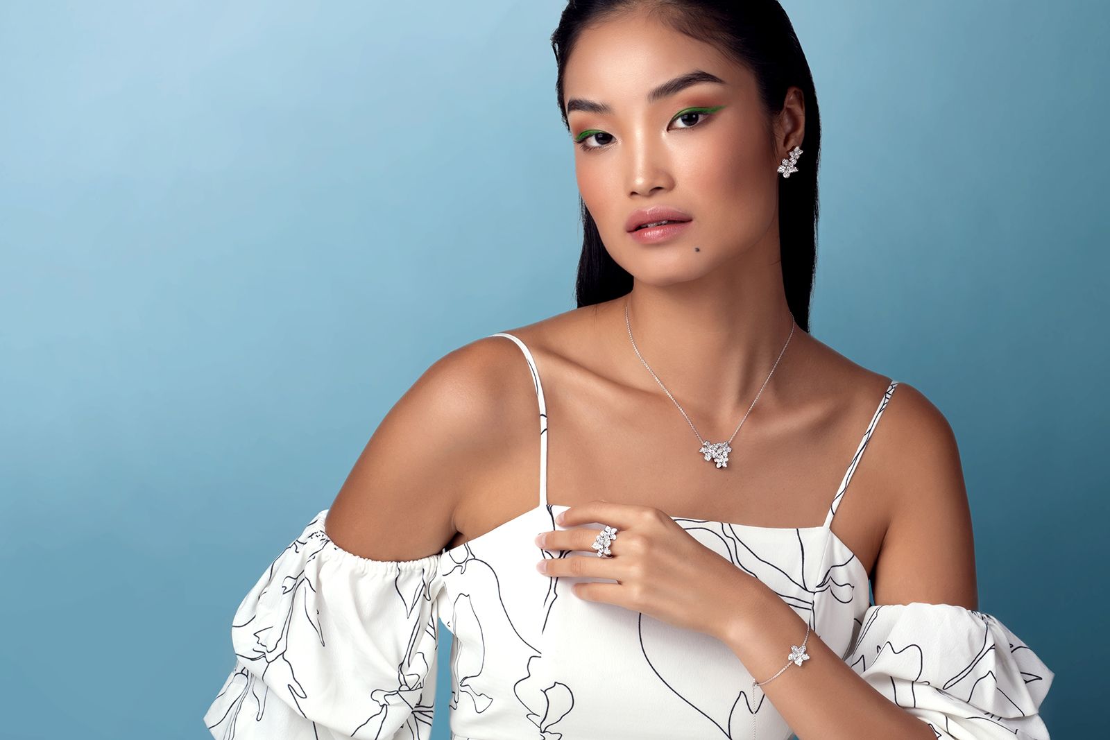 A model wears pieces from the Plumeria On My Mind Collection by Stenzhorn