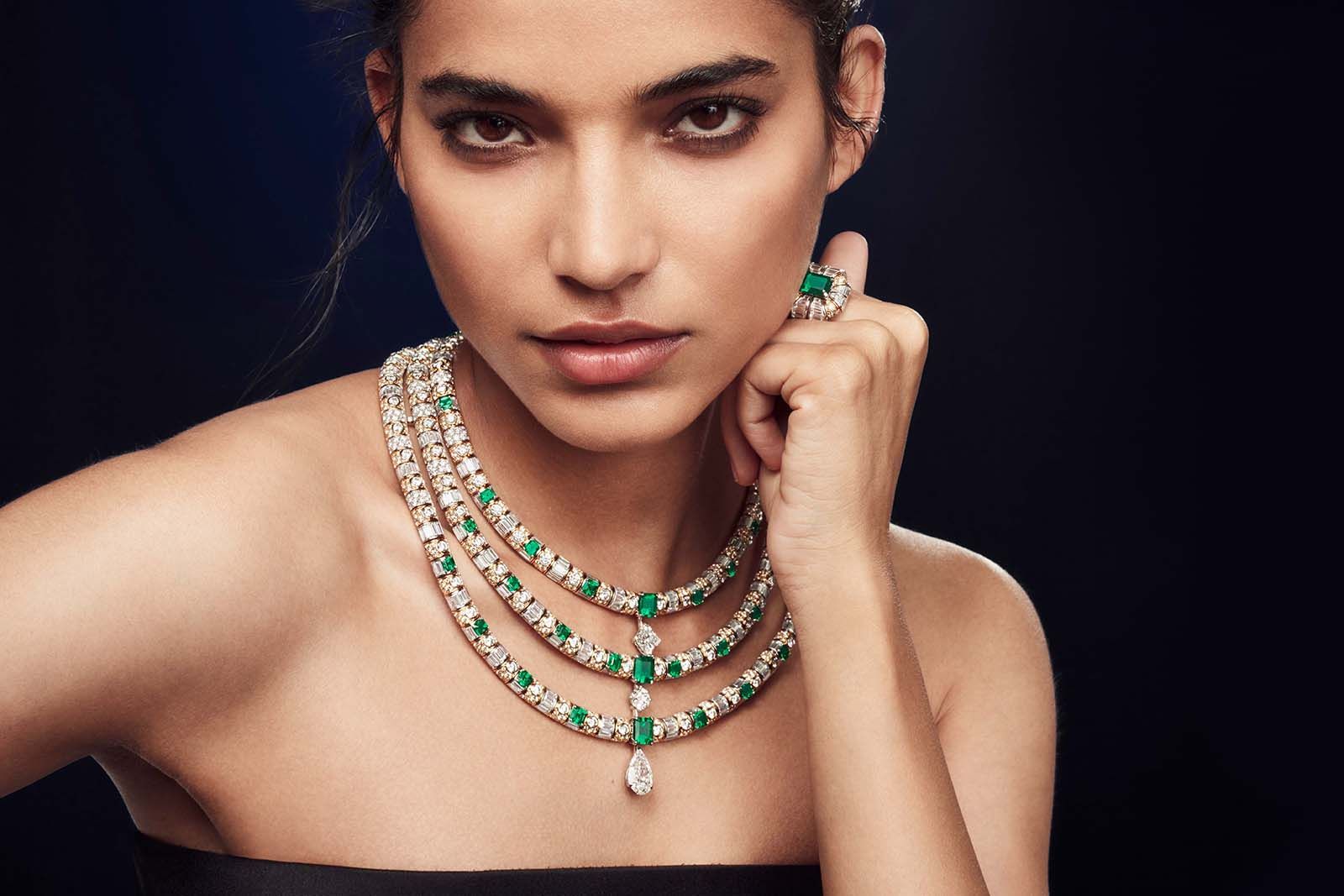 L’Aventure necklace from the Bravery by Louis Vuitton Collection with a pear-shaped diamond of 5.21 carats, an LV Monogram flower-cut diamond of 3.02 carats, and a brilliant-cut diamond of 1.62 carats, alongside emeralds, custom-cut diamonds and brilliant-cut diamonds