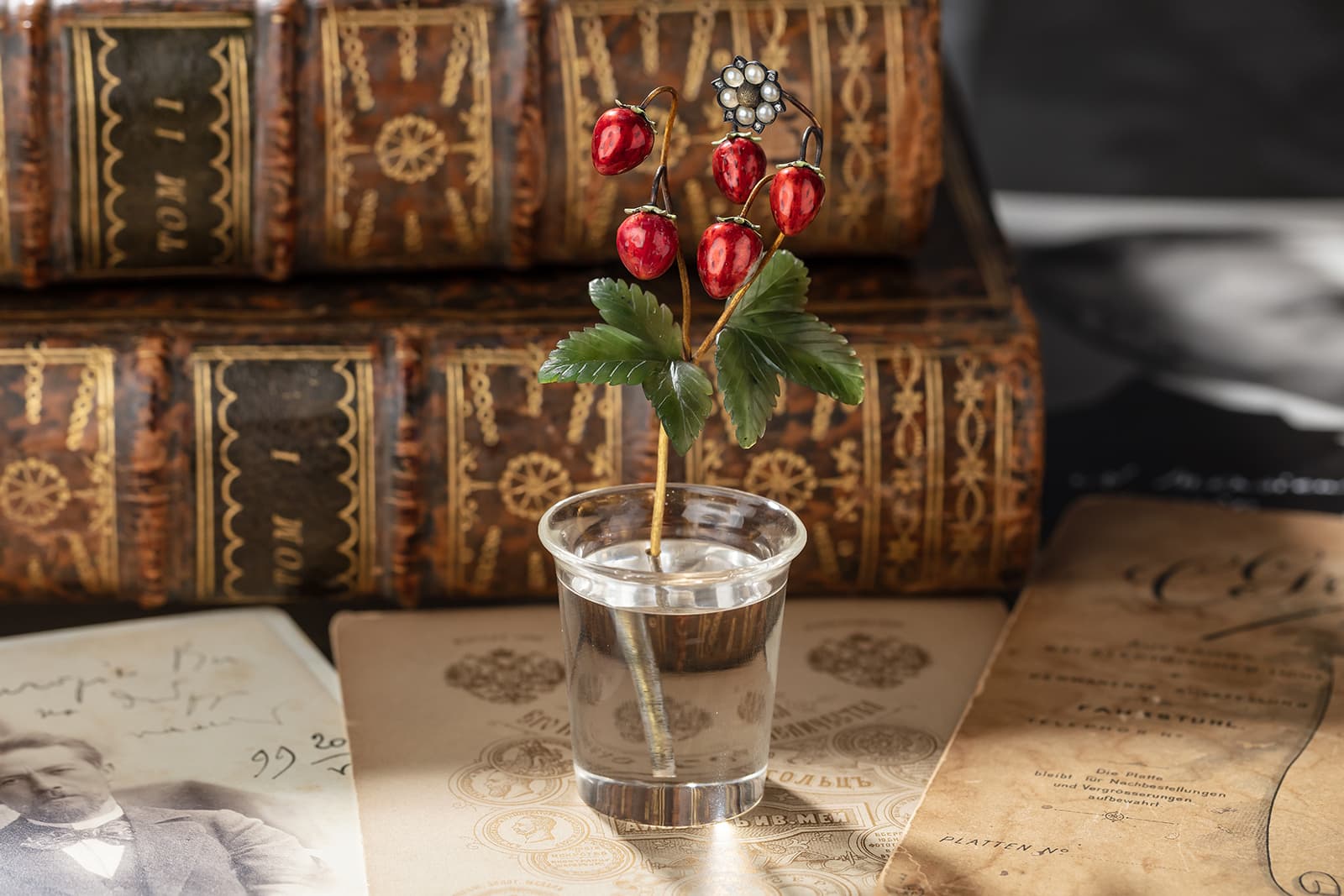 Fabergé gold-mounted enamel, nephrite and rock crystal study of wild strawberries (circa. 1900) with a cylindrical rock crystal vase, gold stem, nephrite leaves and enamelled strawberries with seed pearls and diamonds