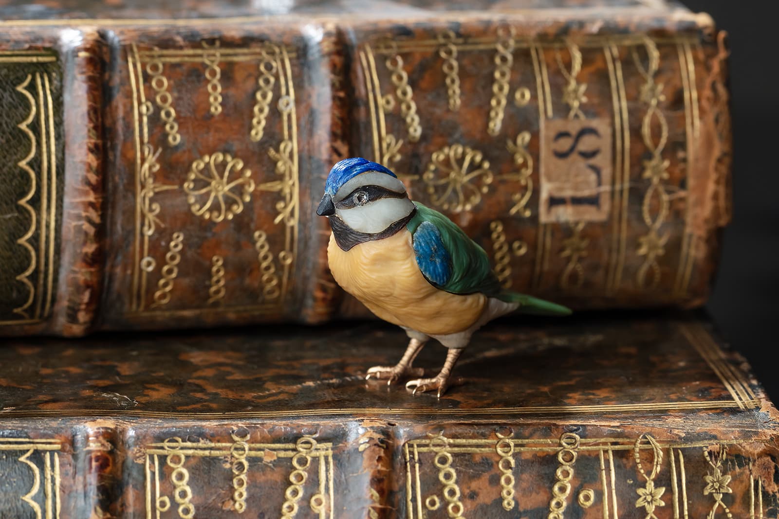Fabergé model of a blue tit (circa. 1900) carved from lapis lazuli, yellow chalcedony, bowenite, agate and onyx with rose-cut diamonds and gold feet